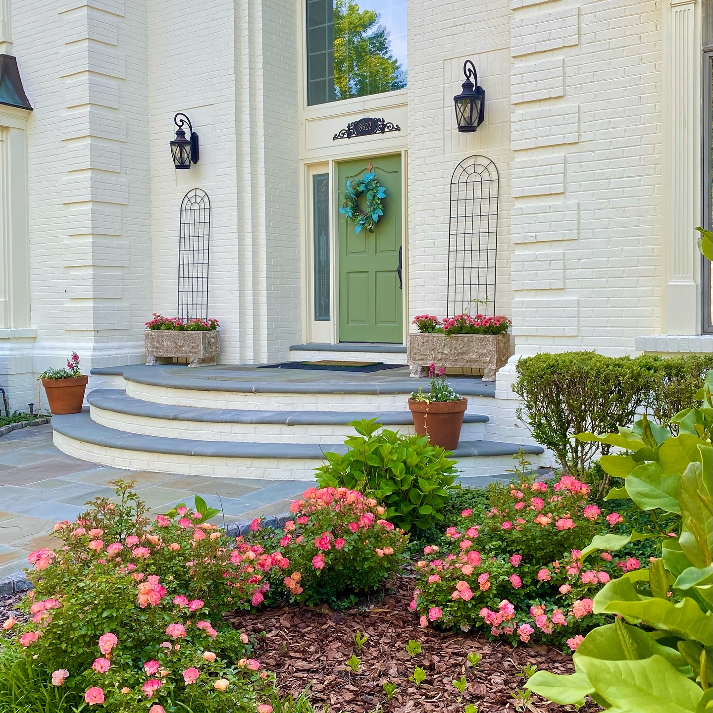 18. Lush Lavender Borders Meet Rustic Stone Pathways In a Sunlit Haven