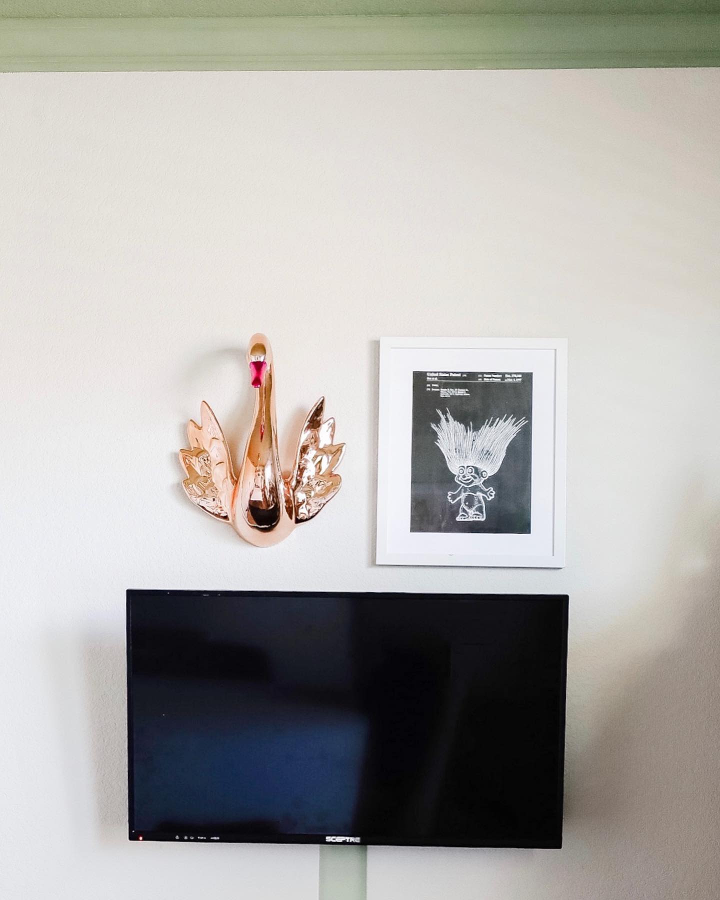 11. Floating Shelves and Faux Plants Frame Your Entertainment: a Green Oasis Above the Tv