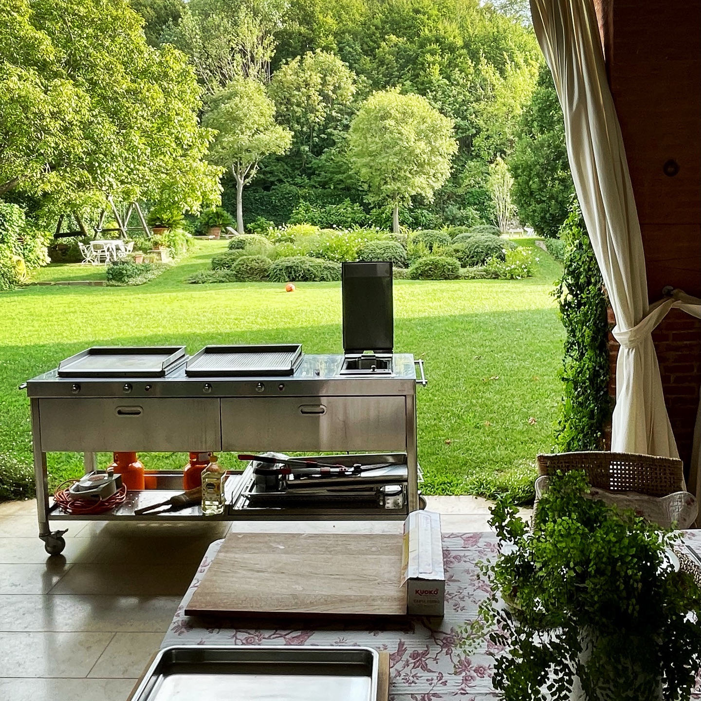 7. the Rustic Charm Of a Pallet Wood Countertop with a Crimson Umbrella Canopy
