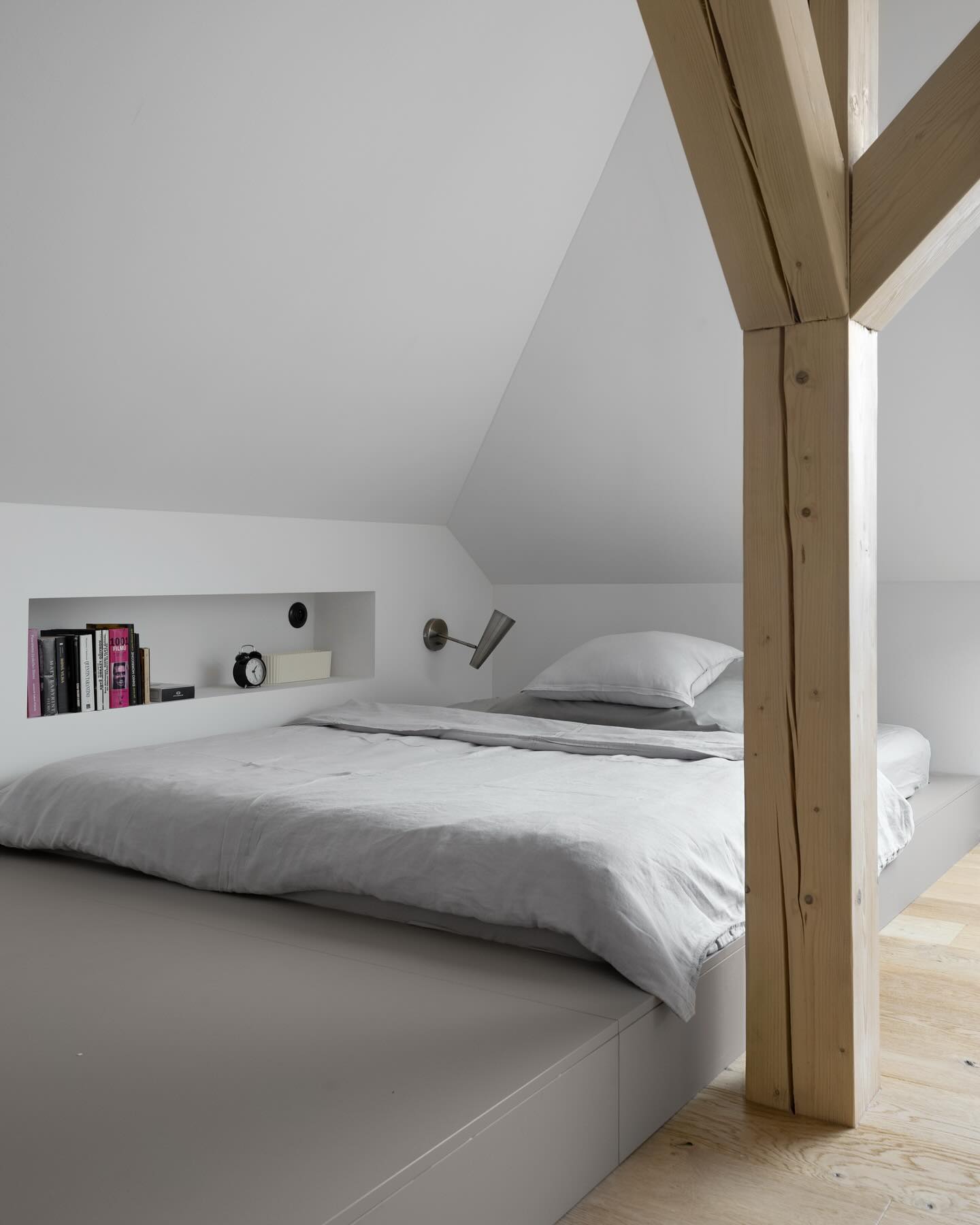 15. Sunlit Serenity: a Gabled Nook with Exposed Beams and Cozy Reading Corner