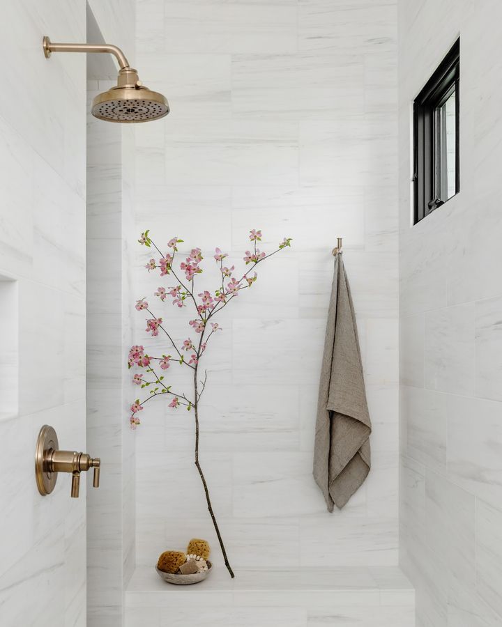 24. Frosted Glass Panels and Cobblestone Floor Fusion Walk-in Shower