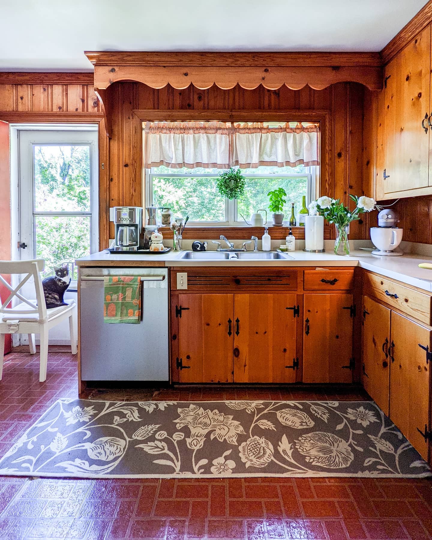 31. Mid Century Mosaic Backsplash Meets Sleek Walnut Cabinets In a Retro Revival