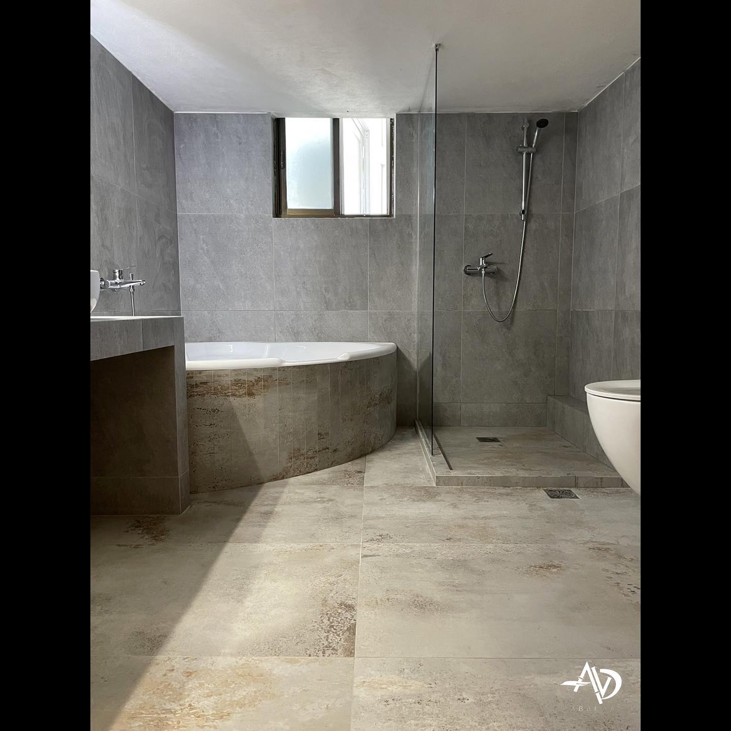 1. Waves Of Serenity: a Tub Encased In River Rock Elegance