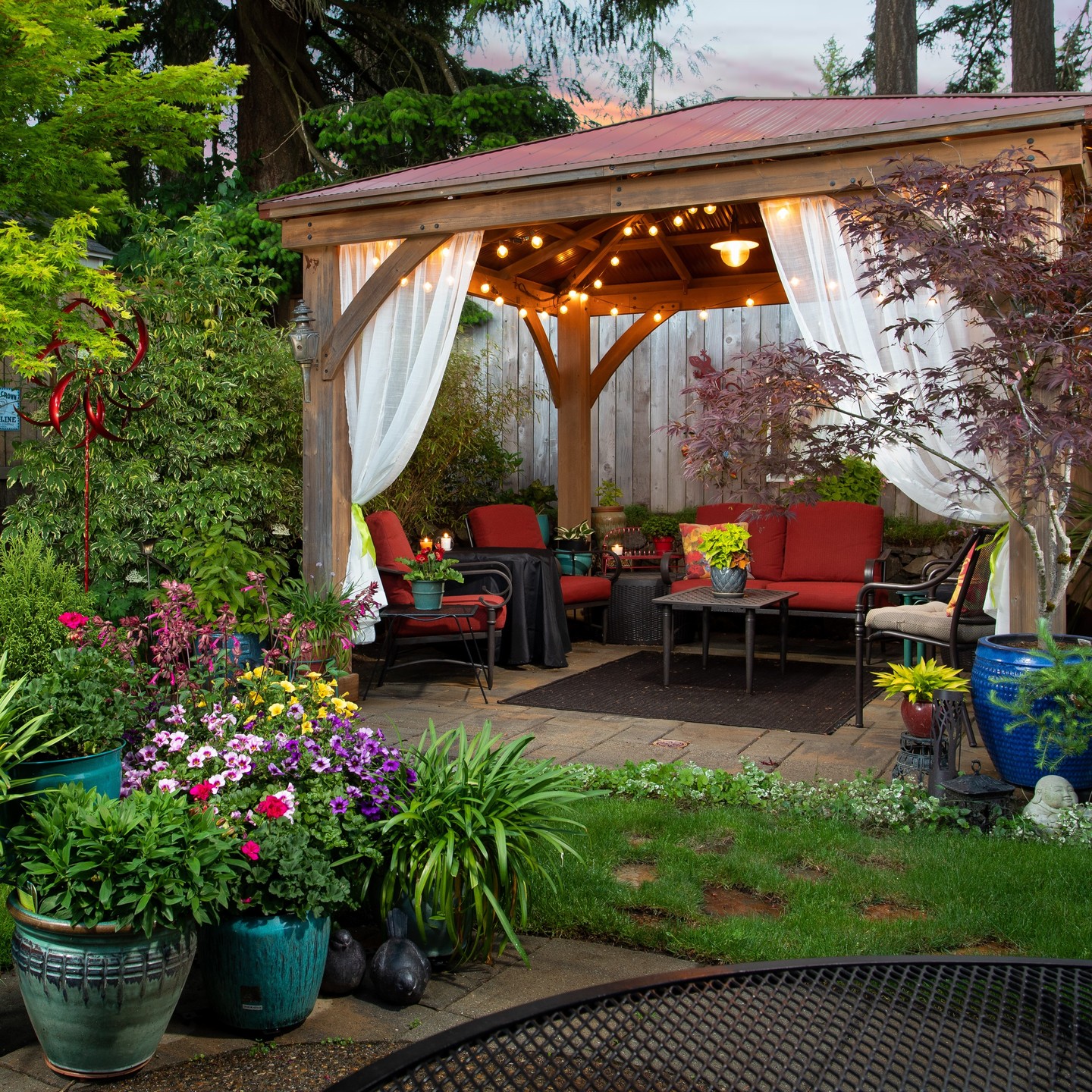 7. Moonlit Pergola with String Lights and Wooden Seating Nook
