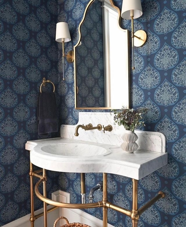 22. Silver Orchid Mirror and Crystal Chandelier Fusion In a Powder Room