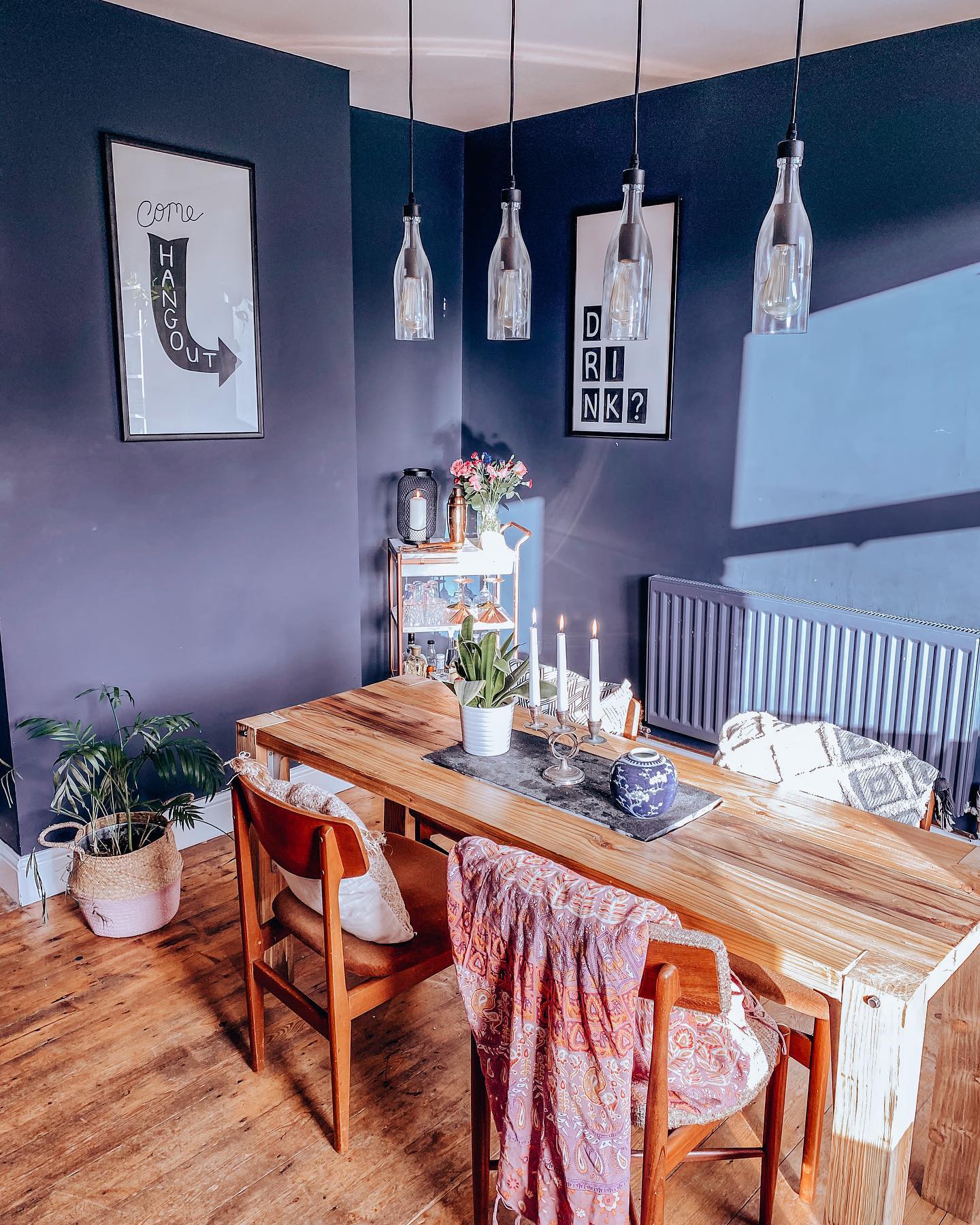 30. Cascading Macrame and Eucalyptus Over a Sunlit Wooden Table
