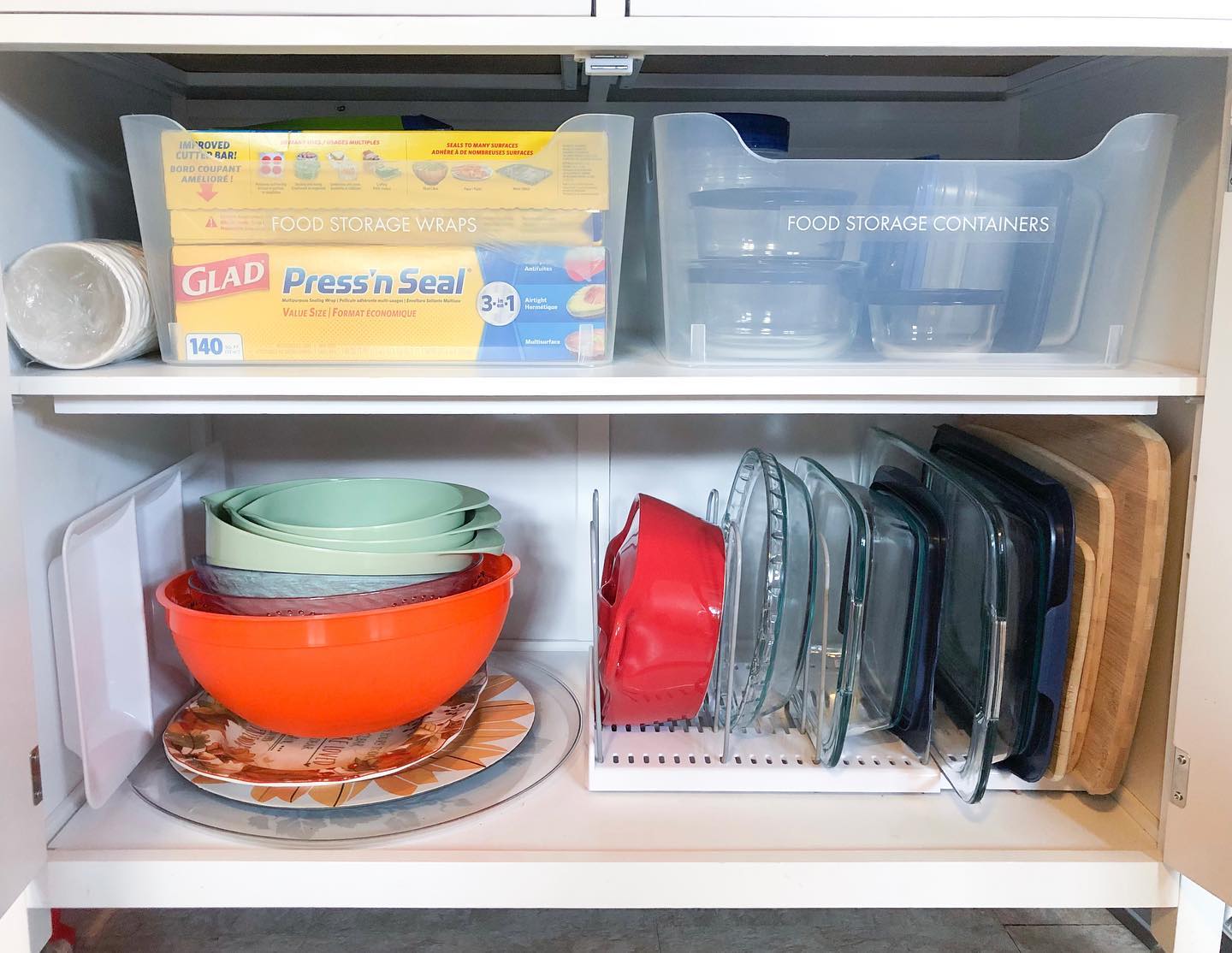 37. Sleek Slide-out Spice Shelves with Geometric White Tiles