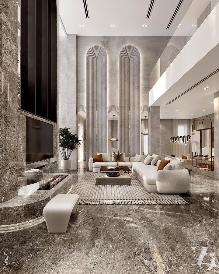 1. High Ceiling Drama with a Floating Fireplace and Geometric Rug