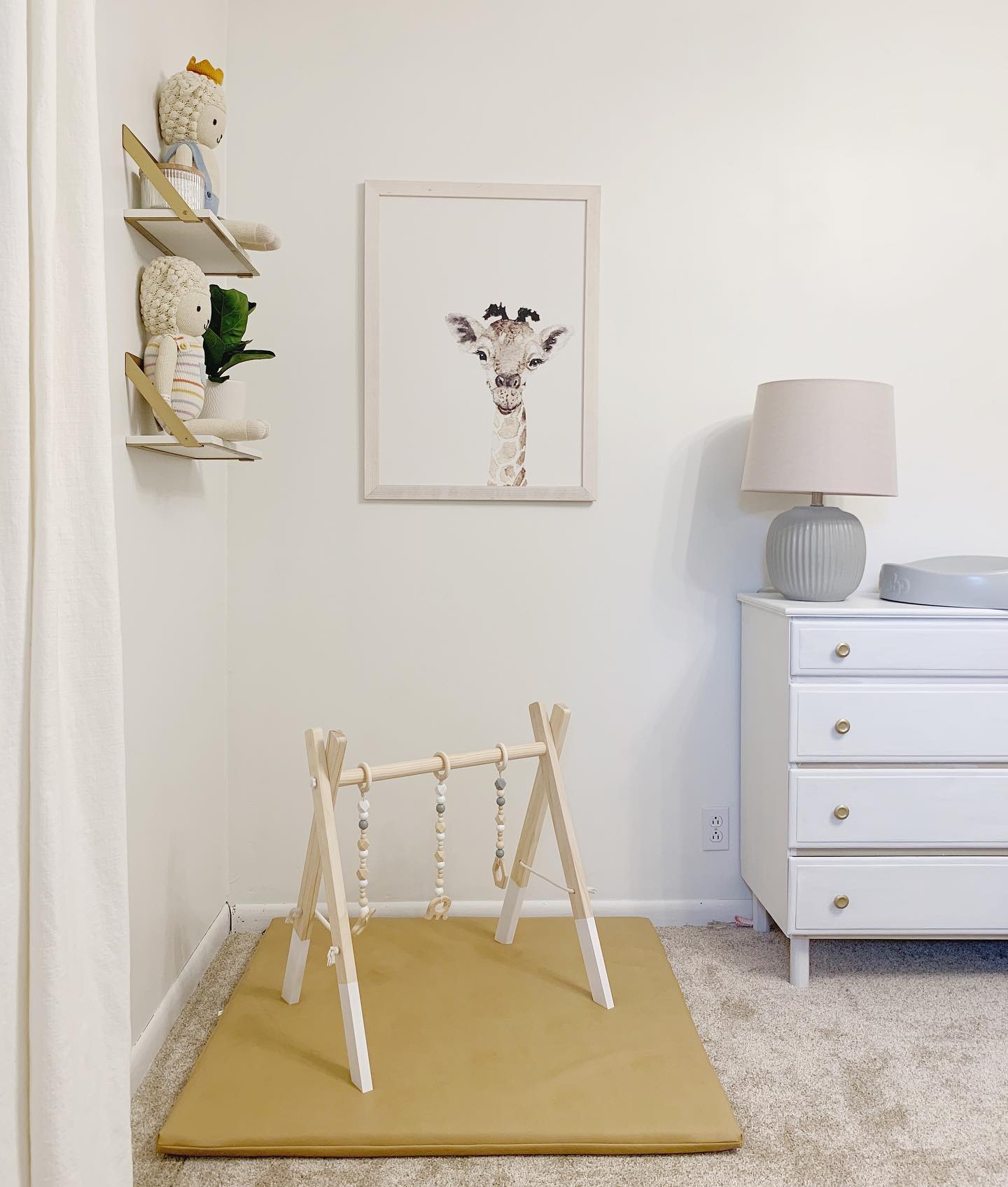 7. Vibrant Rainbow Archway Over Cozy Play Nook with Plush Giraffe Companion