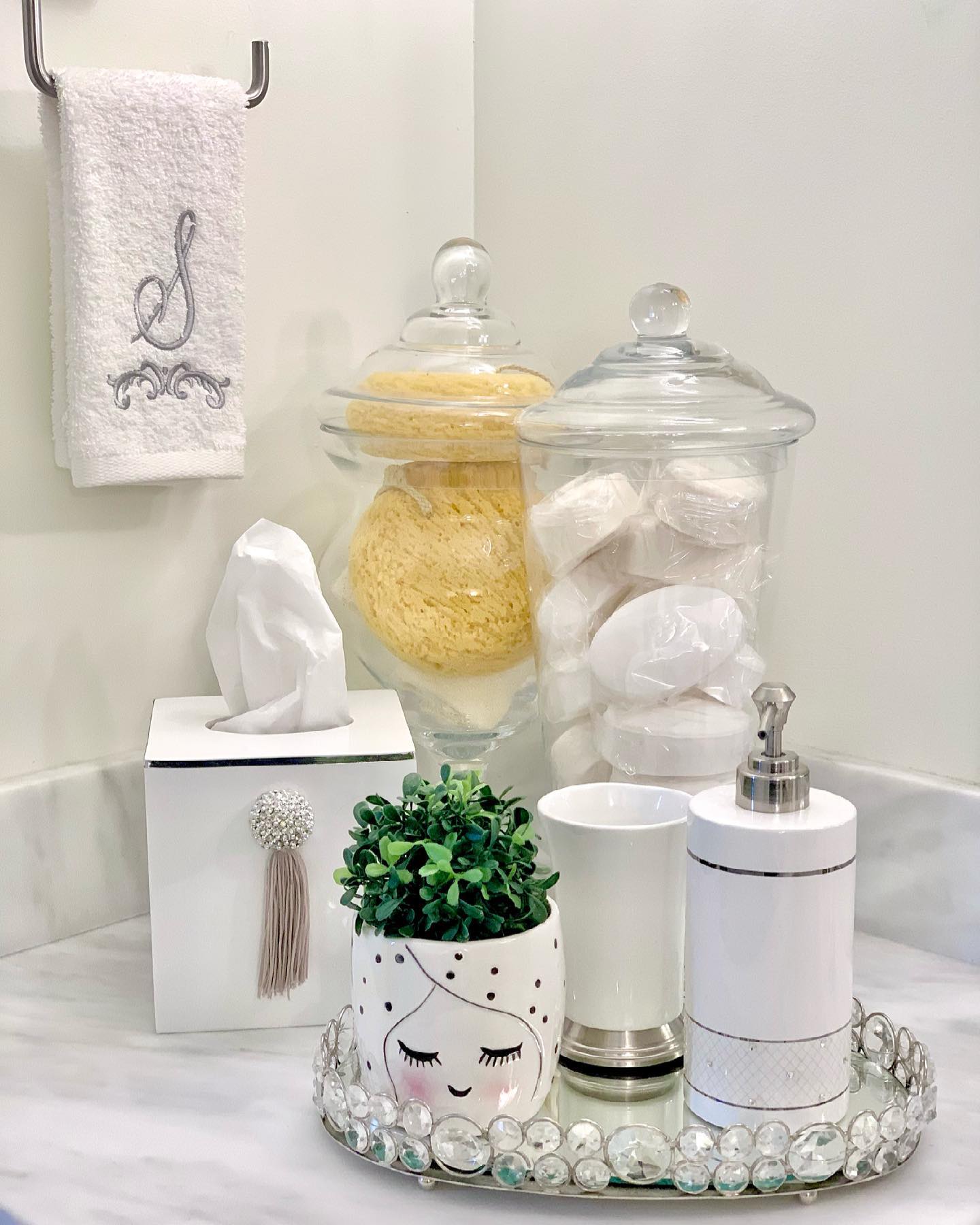 3. a Sea Glass Soap Dispenser Nestled Among Vintage Brass and White Subway Tiles