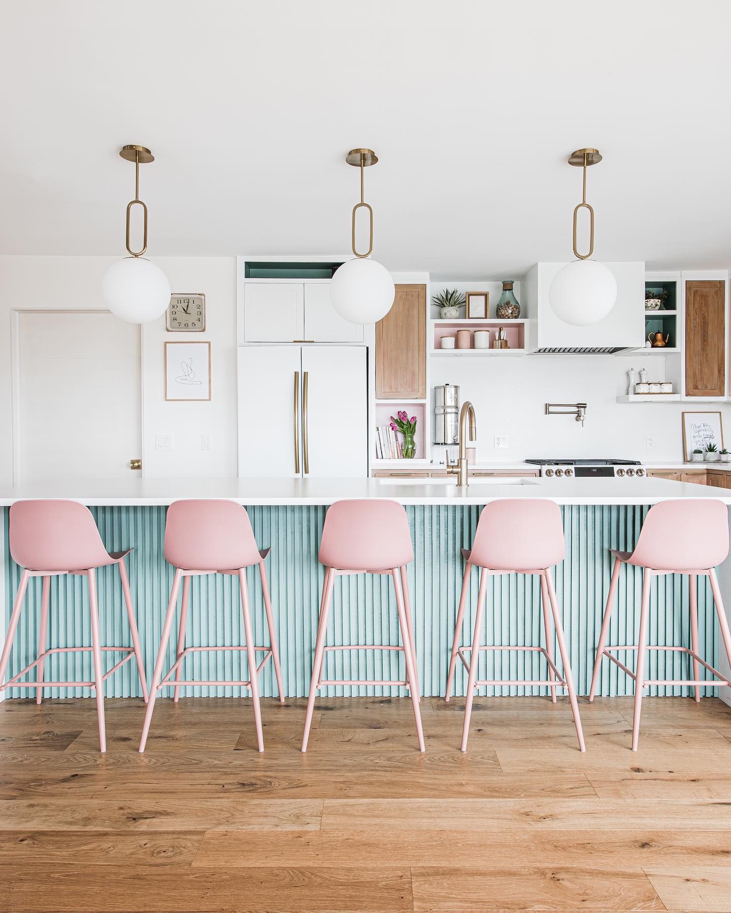 10. Mid Century Maple Cabinets with Geometric Tiled Backsplash and Teardrop Pendant Lights