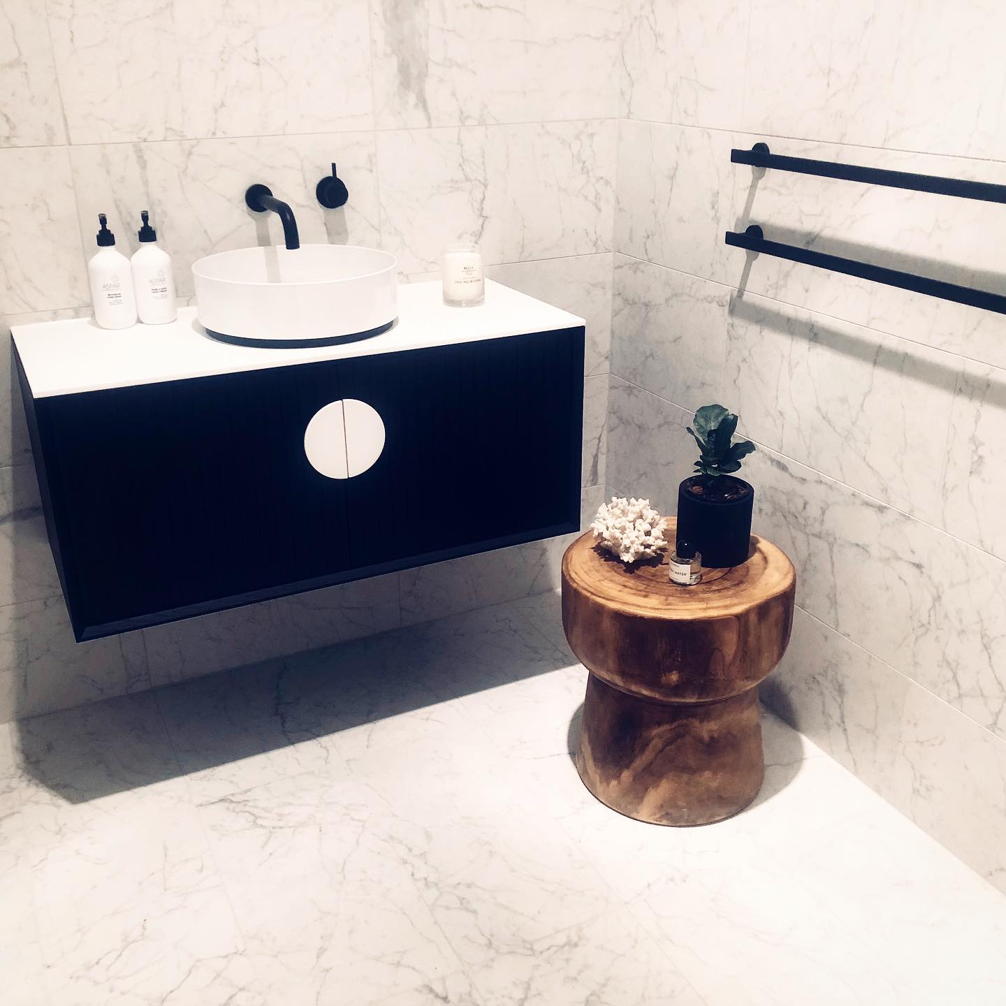 5. a Single White Orchid In a Clear Vase Beside a Bamboo Toothbrush Holder on a Marble Counter