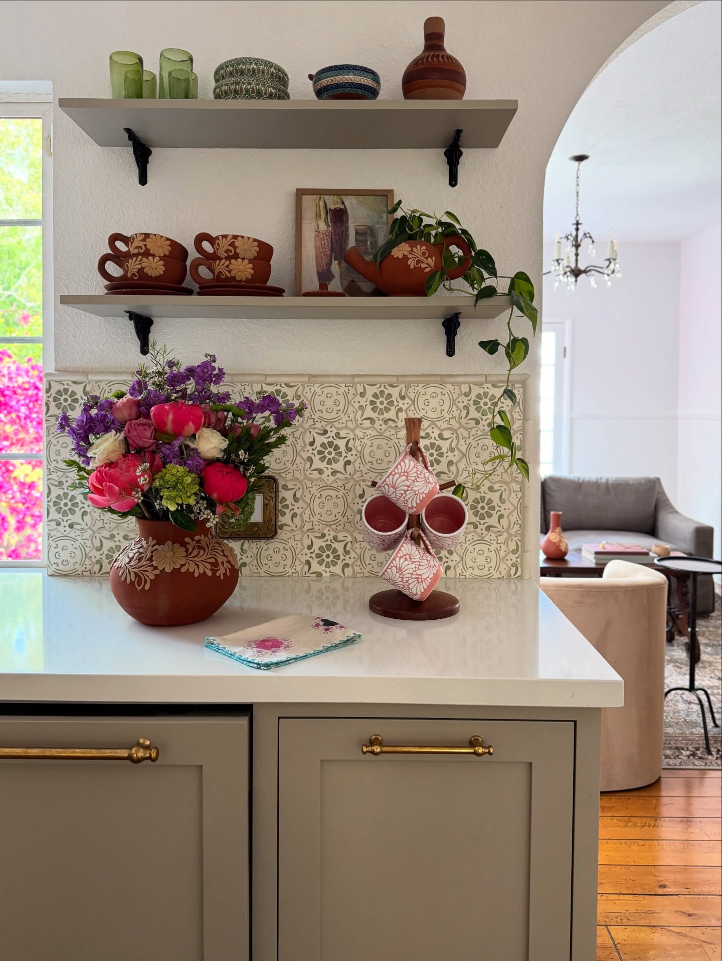 5. Vivid Magenta Cactus Amidst Geometric White Shelves