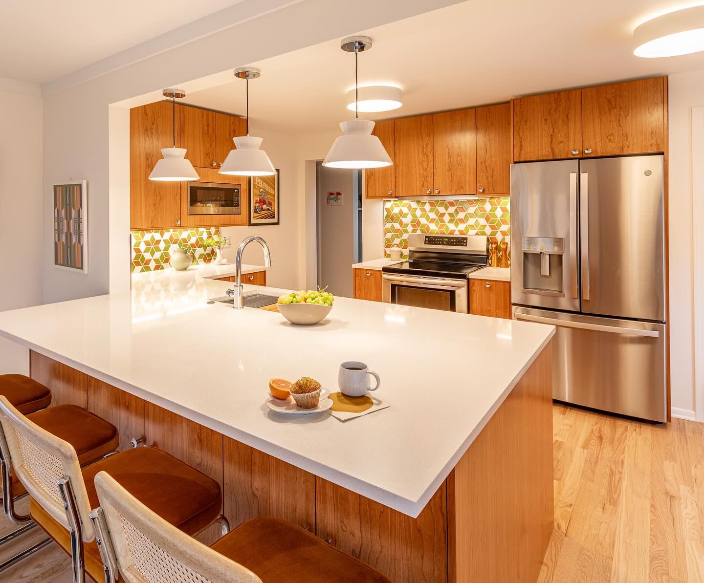 30. Sleek Teak Panels and Retro Red Accents Define This Kitchen's Character