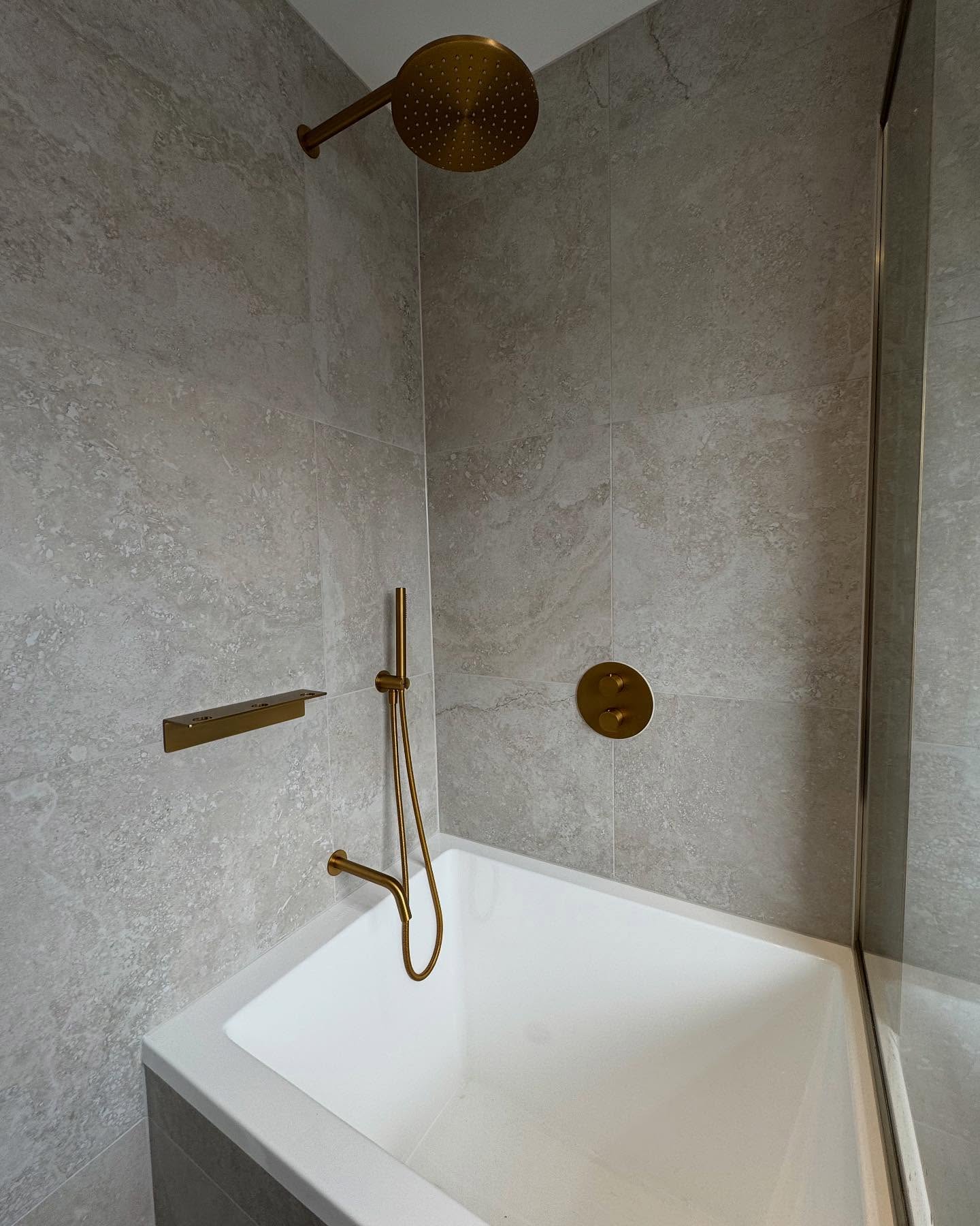 16. Moonlit Marble Mosaic: a Walk-in Shower with Crescent Tiles and Starry Accents