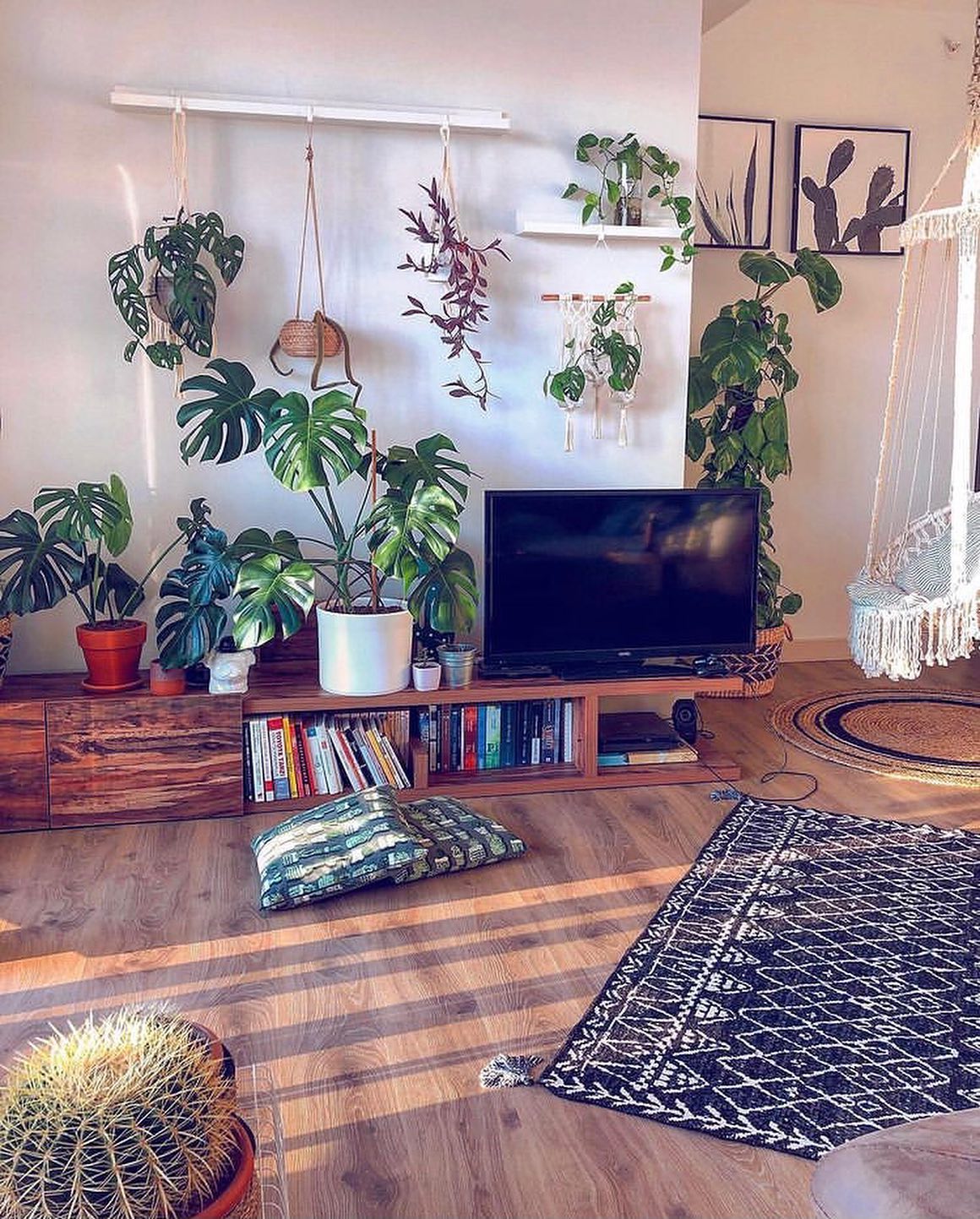 4. a Woven Basket with Greenery and a Single White Orchid Above a Flat-screen Tv