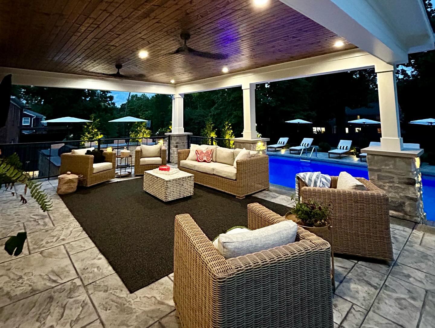 24. a Sunlit Haven with a Chevron-patterned Pergola and Eclectic Seating