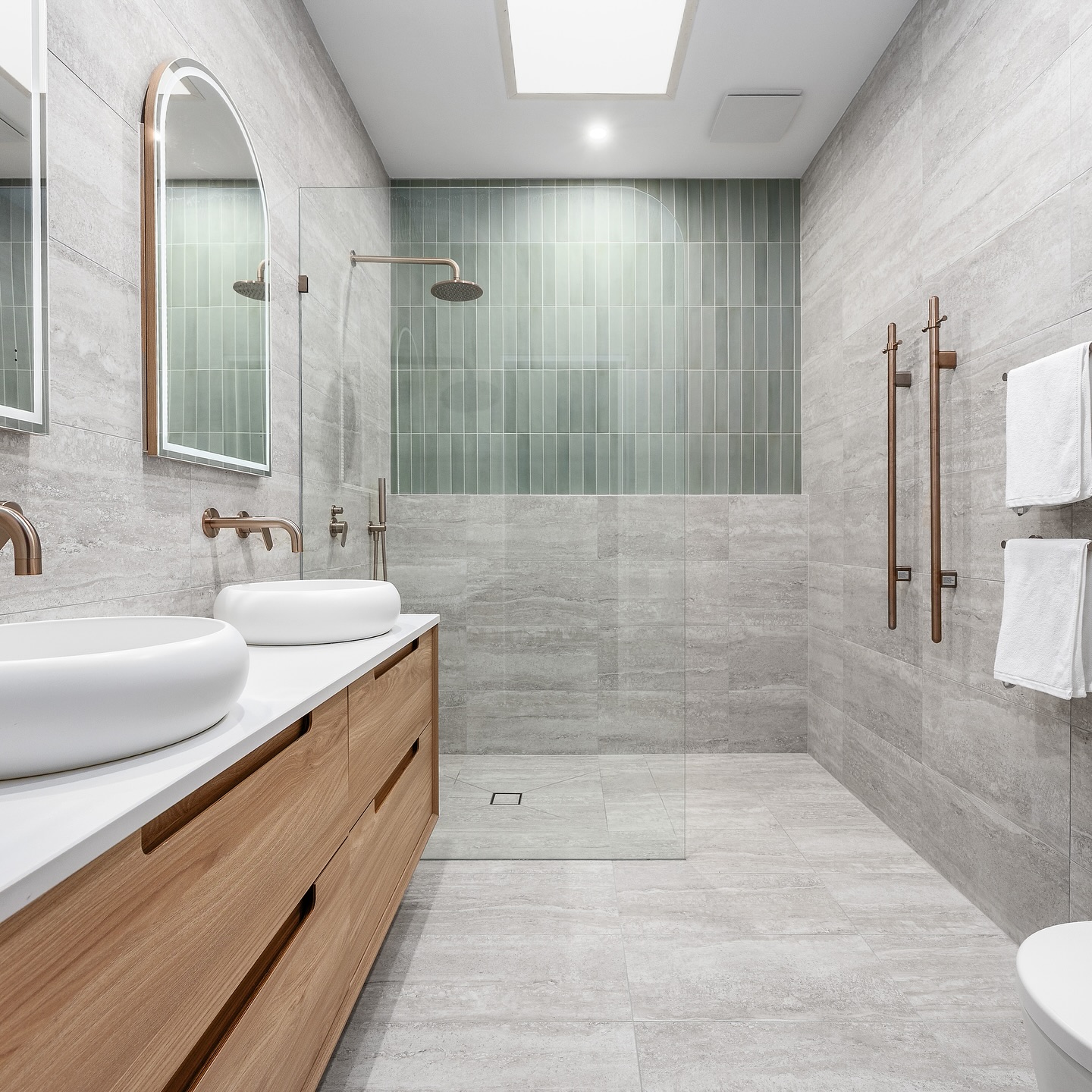 35. a Cascade Of Glass with a River Stone Floor and Dual Shower Heads