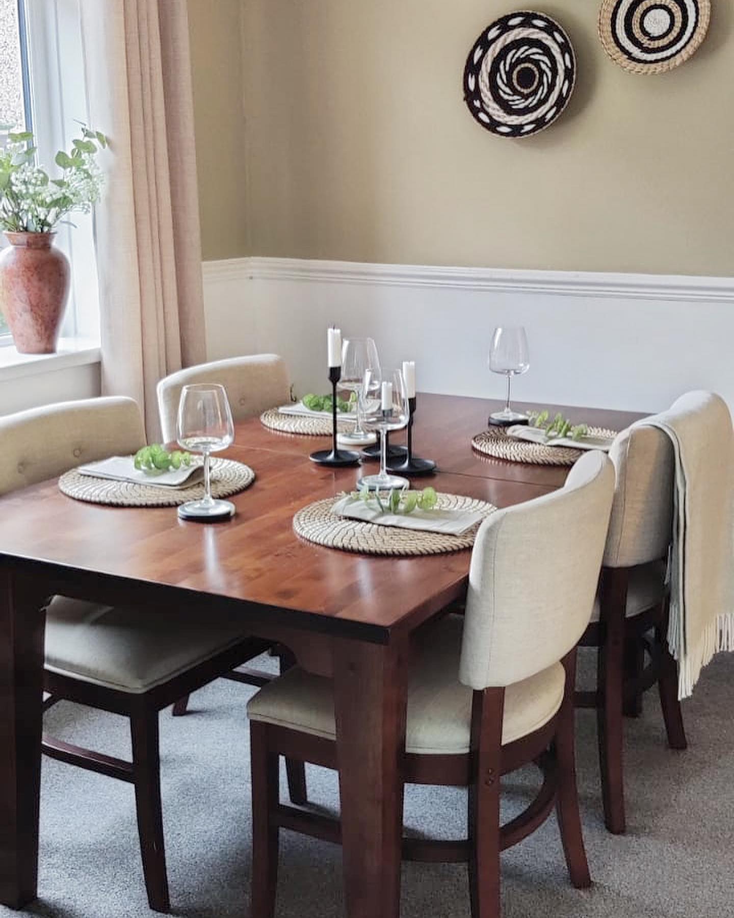 7. Boho Dining Room with Woven Chandelier and Macrame Plant Holders