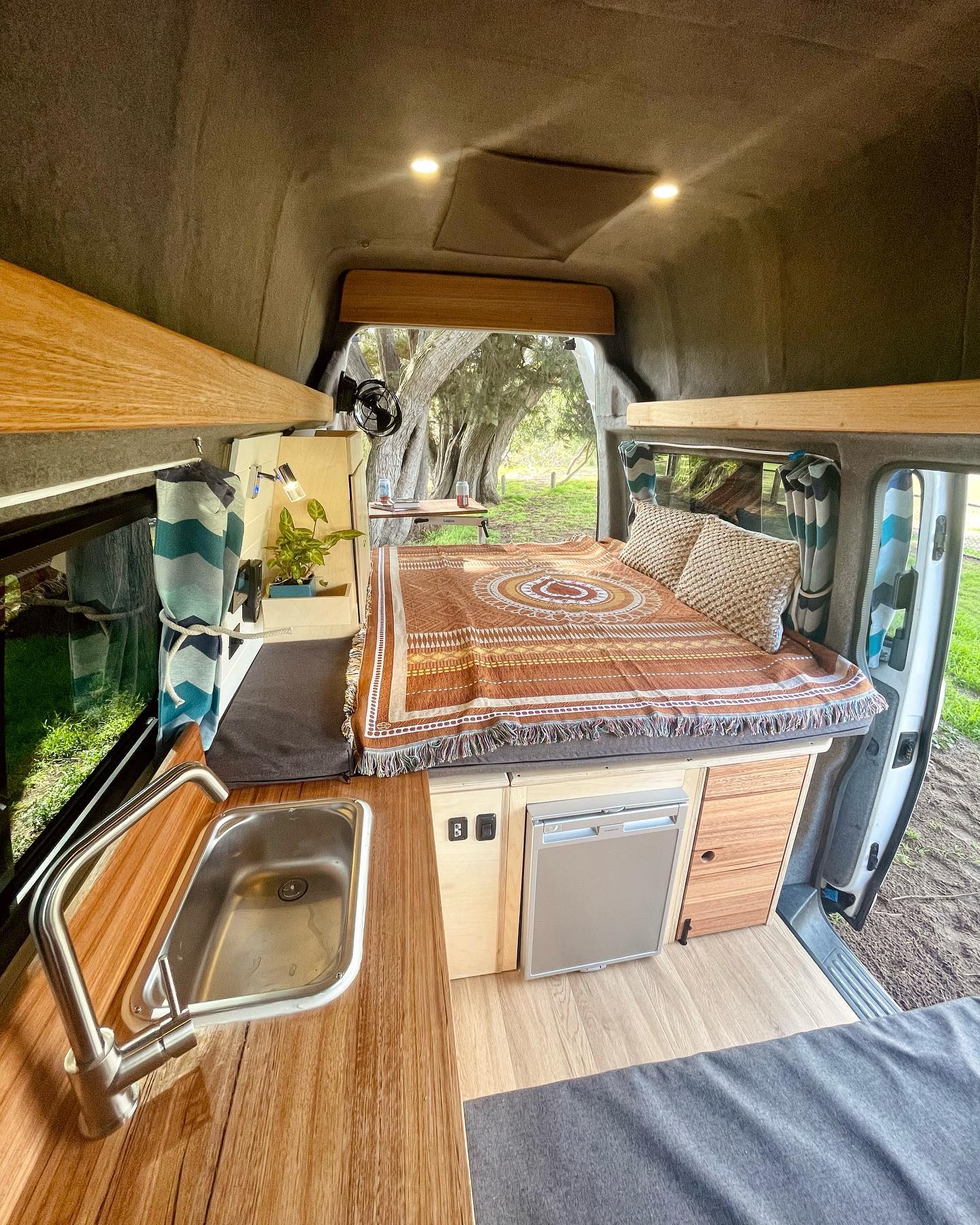 2. Twilight Blue Camper Haven with Geometric Accents and Cozy Nook