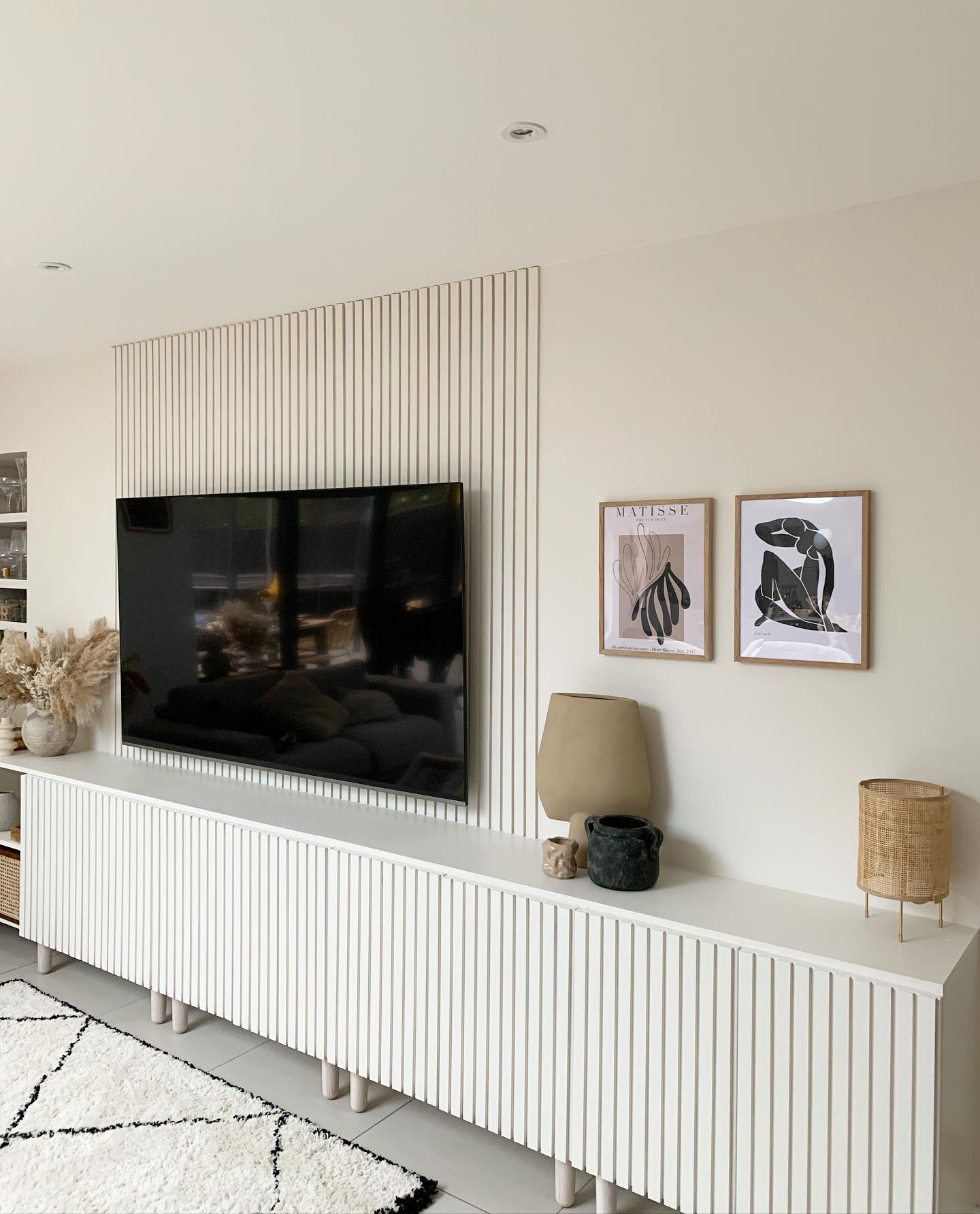 23. a Driftwood Mobile and Potted Plant Perched Above the Television