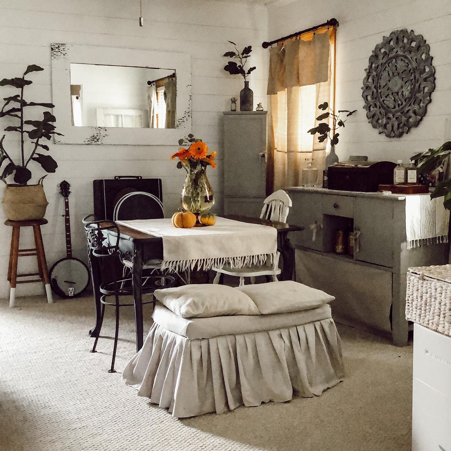 14. Boho Tapestry and Rattan Chandelier Fusion Dining Space