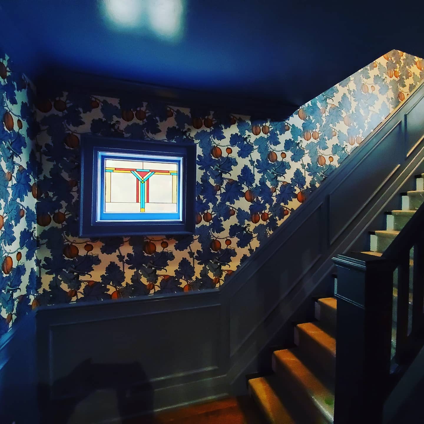 38. Spiraling Eucalyptus and Gold Accents on Stairway Risers