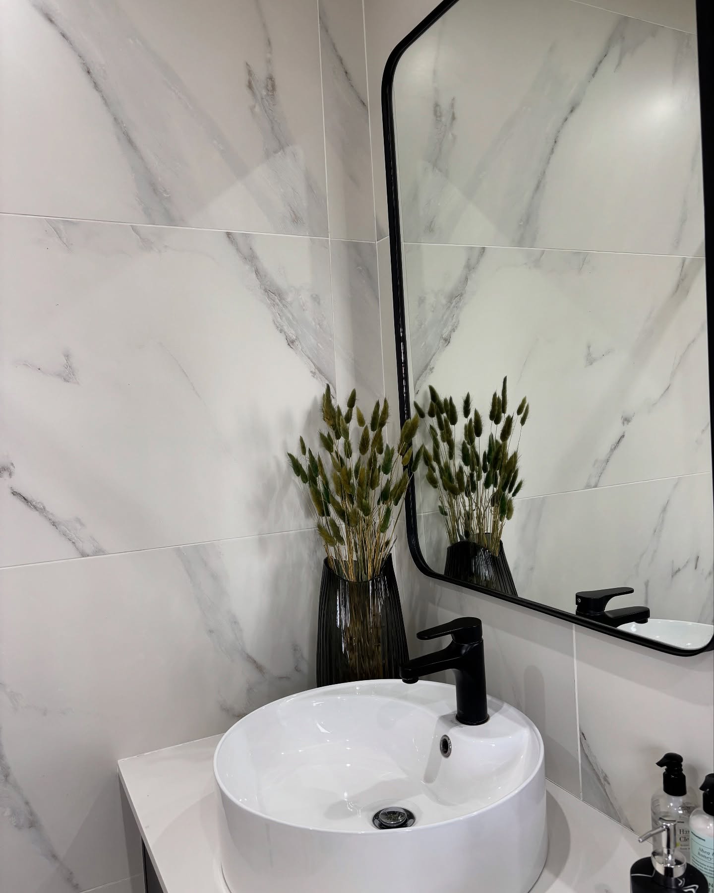 10. Moonlit Marble and Copper Accents: a Bathroom Countertop Oasis