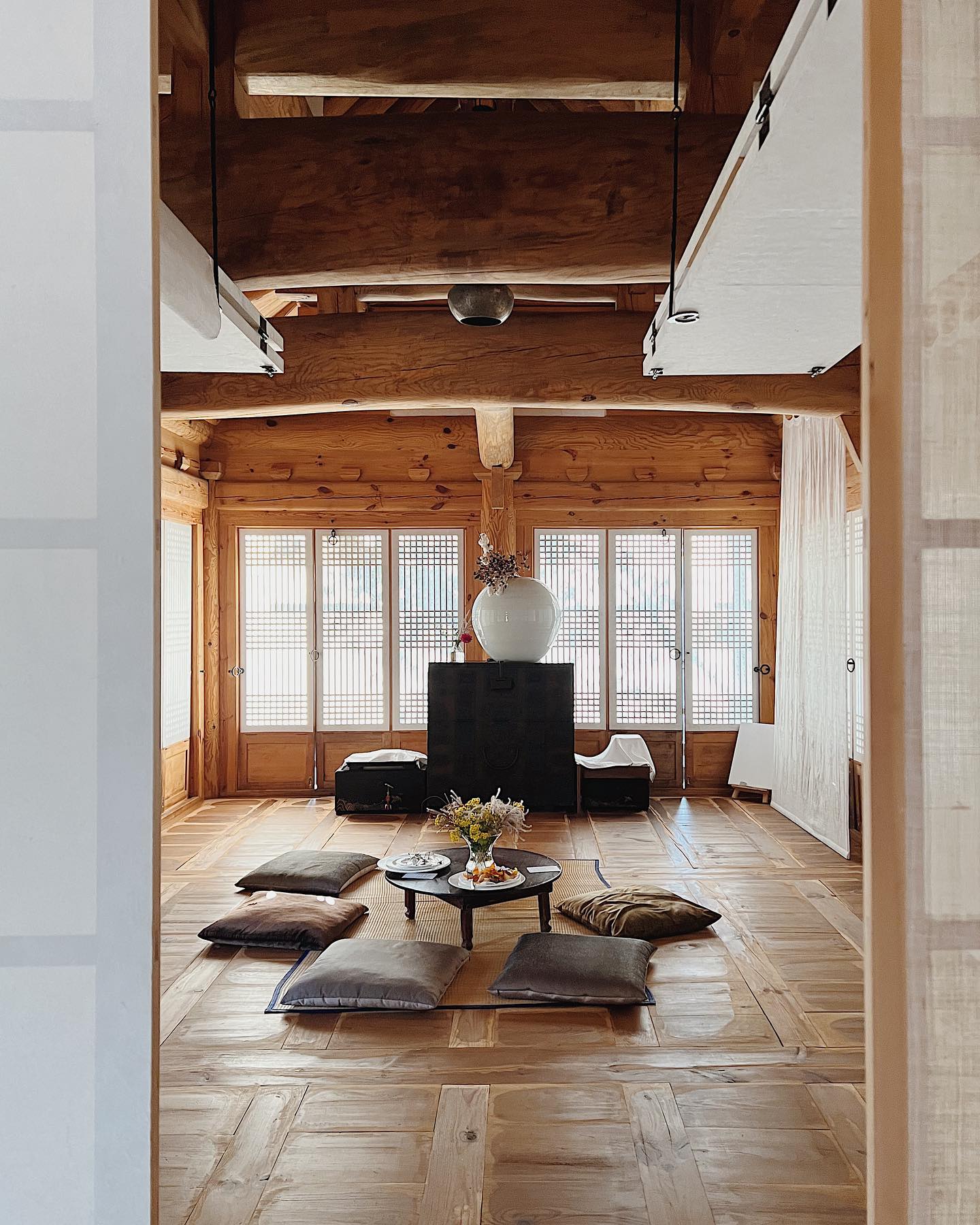 19. Cobweb-covered Chandelier and Sun-dappled Bookshelves In an Attic Retreat