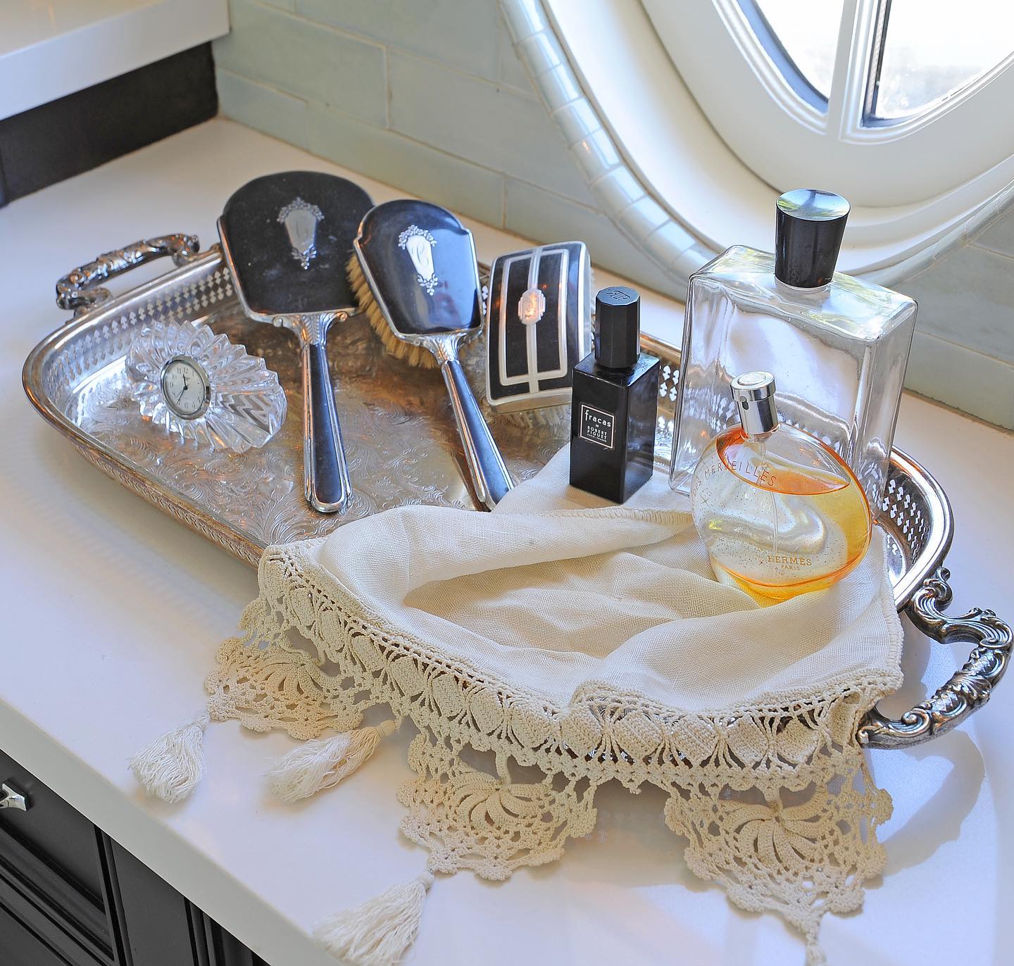 14. a Trio Of Amber Bottles Beside a Sleek Black Pebble Soap on a Crisp White Counter