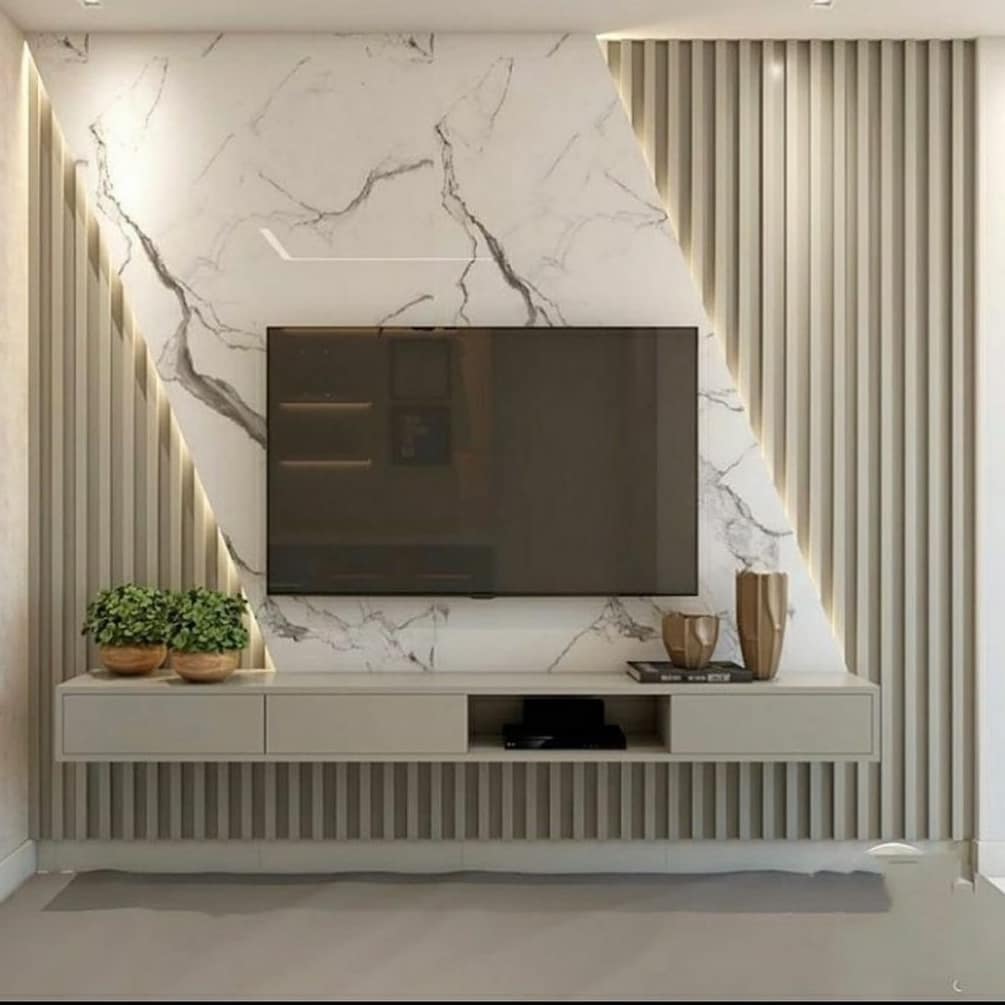 32. Floating Bookshelf Illusion with Geometric Planters Above a Flatscreen Tv