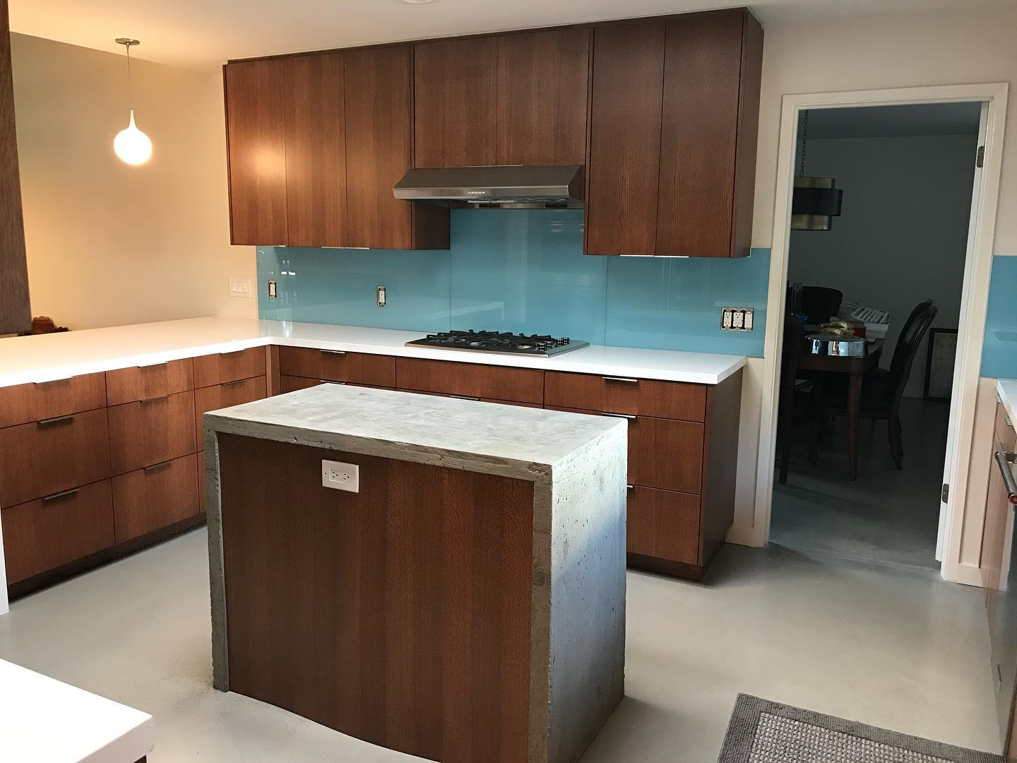 34. Mid Century Modern Kitchen with Retro Green Tiles and Atomic Starburst Clock