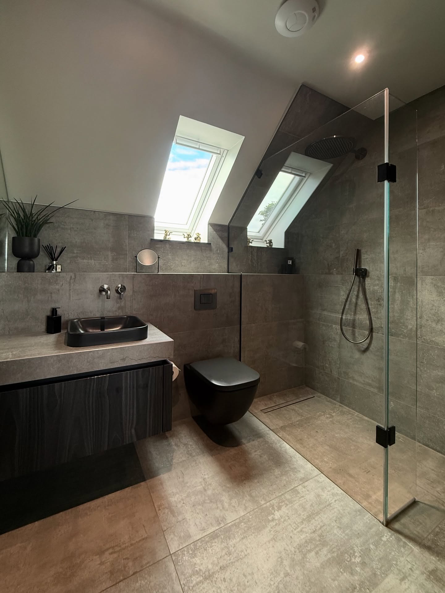 4. Vibrant Mosaic Tiles and Sleek Black Fixtures Create a Bohemian Oasis