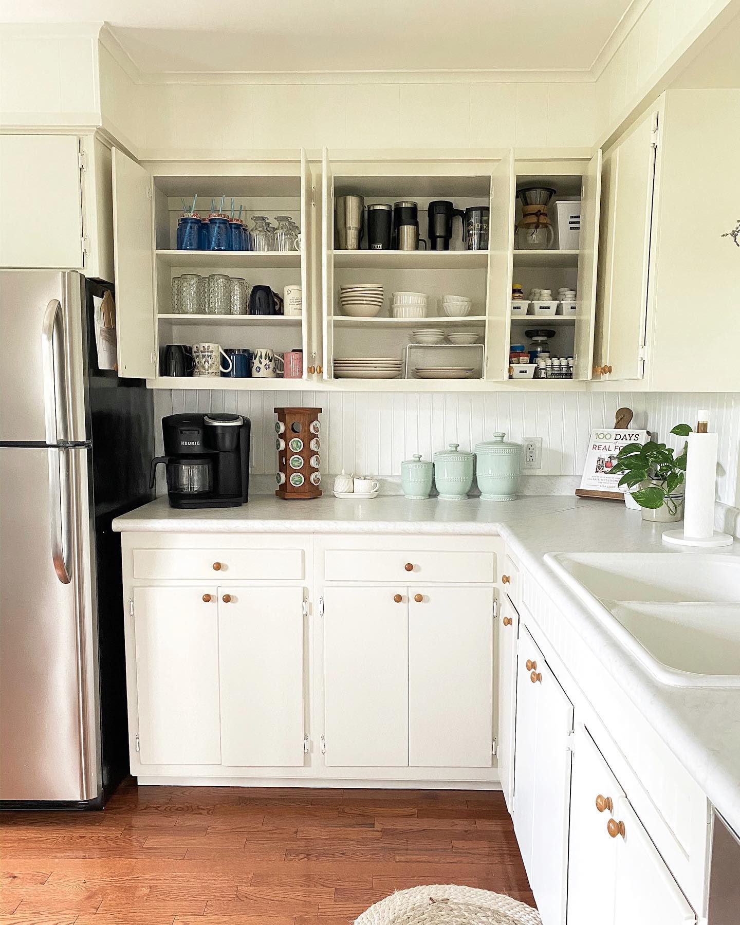 11. Sleek Pull-out Drawers with Copper Accents and Geometric Labels for Spice Jars