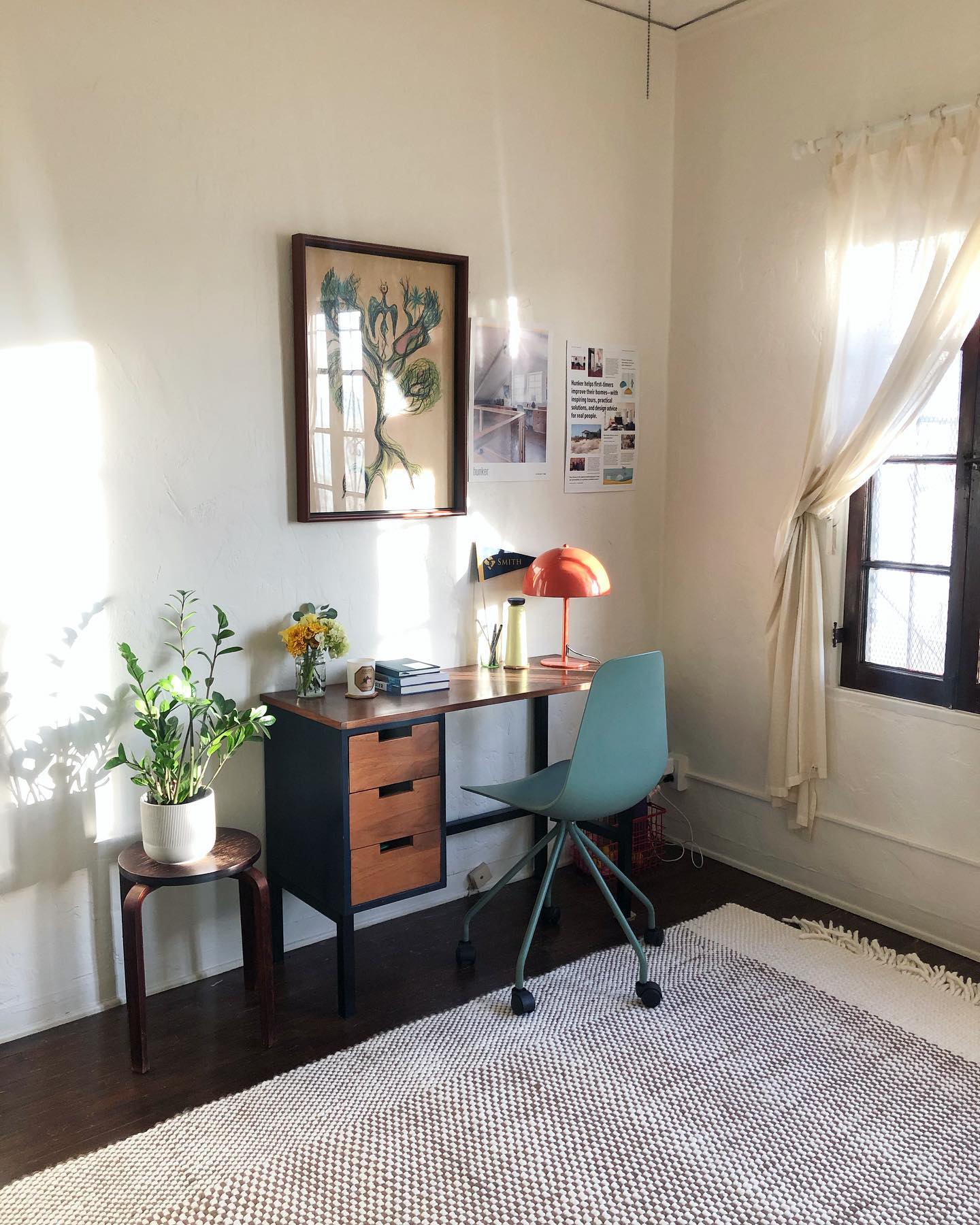 17. the Pecan Wood Desk with Geometric Wall Art and Cactus Accent