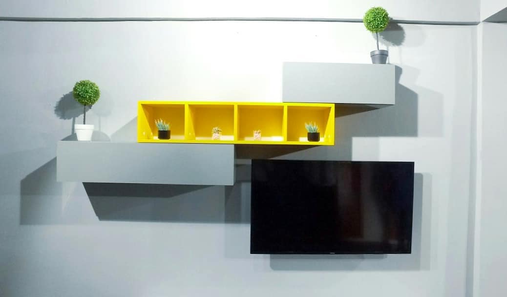 26. Whimsical Driftwood Mobile with Hanging Succulents and Feathers Above a Sleek Black Tv