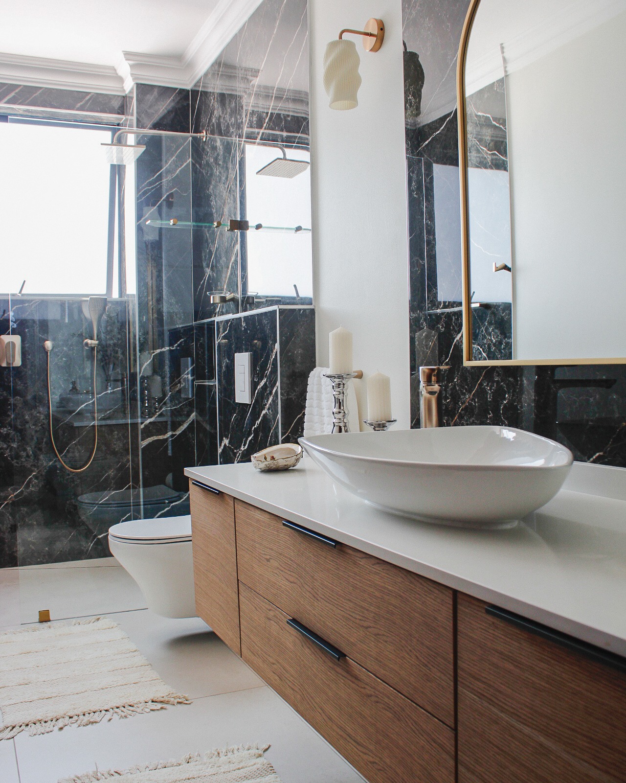2. the Fusion Of Glass and Stone: a Bathroom with a Floating Sink and River Rock Wall