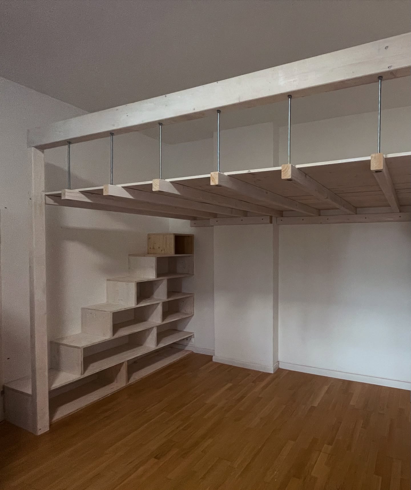 2. a Canopy Of Dreams: Loft Bed with Geometric Quilt and Starry Night Lamps