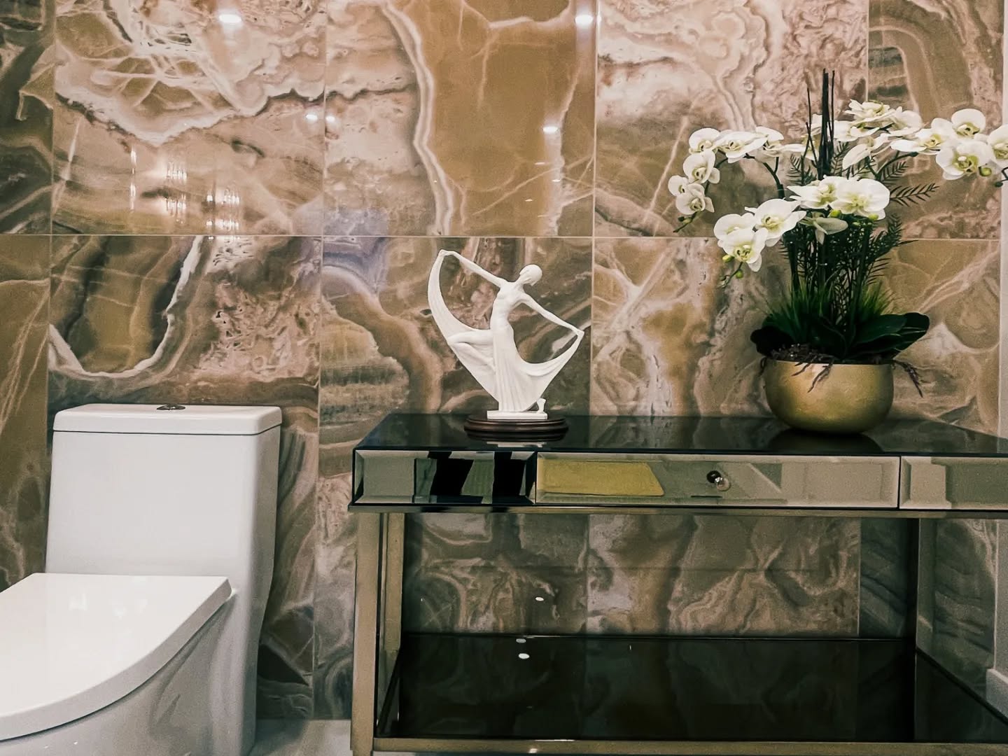 9. Moonlit Marble and Metallic Glow: a Bathroom Counter with a Celestial Vibe