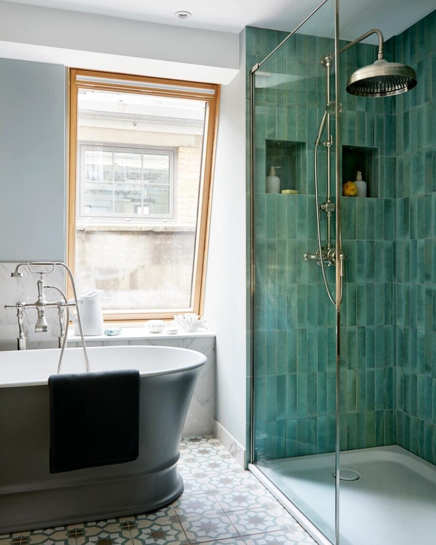 18. the Interplay Of Geometric Tiles and Circular Fixtures In a Slate Gray Walk-in Shower