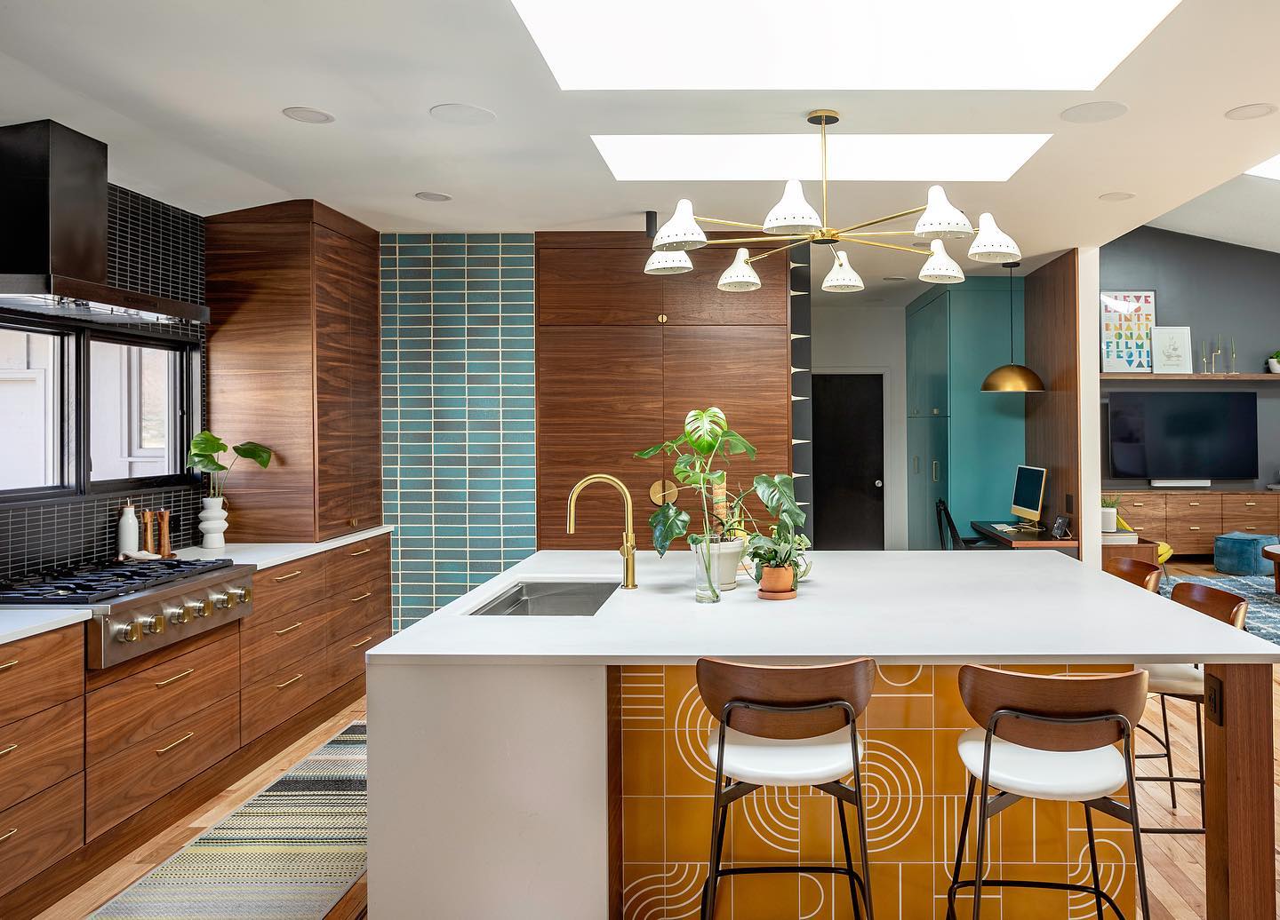 18. Mid Century Maple Cabinets with Teal Accents and Geometric Tile Backsplash