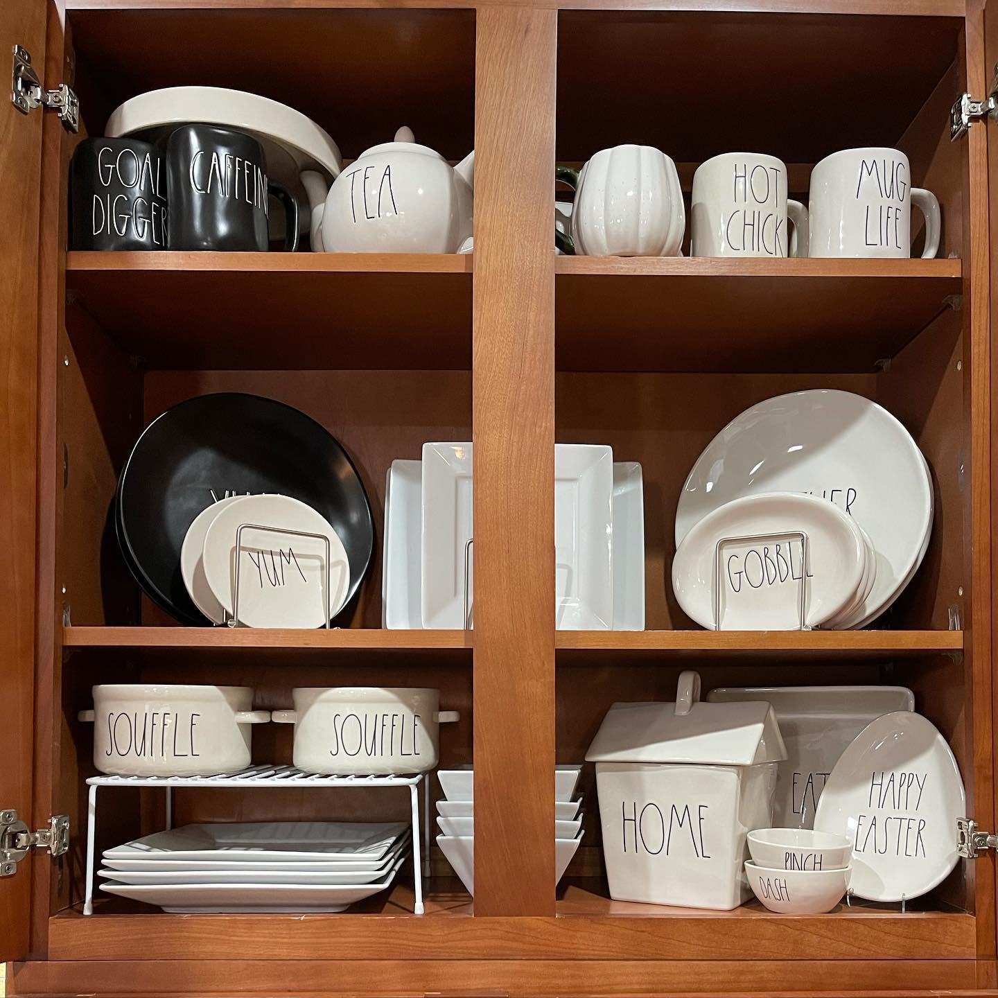 13. Sleek Pull-out Spice Rack with Geometric Black and White Tiles Underneath