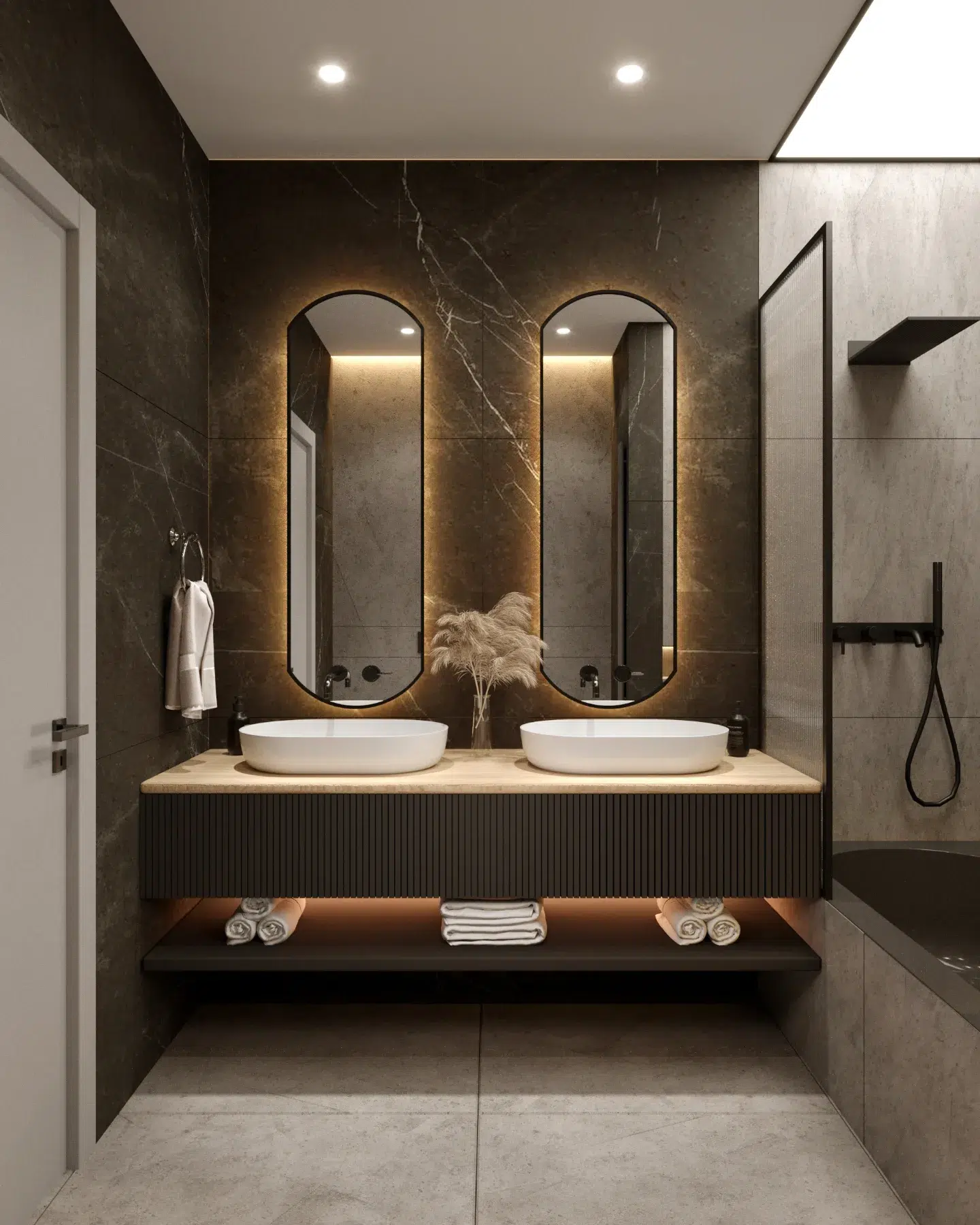 25. Sleek Glass Vessel Sink on a Floating Ebony Wood Vanity with Hidden Lighting