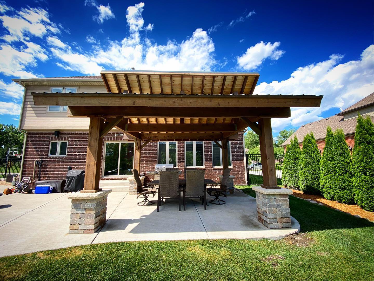 21. Twilight Bamboo Haven: a Covered Patio with Woven Ceiling and Lantern Glow