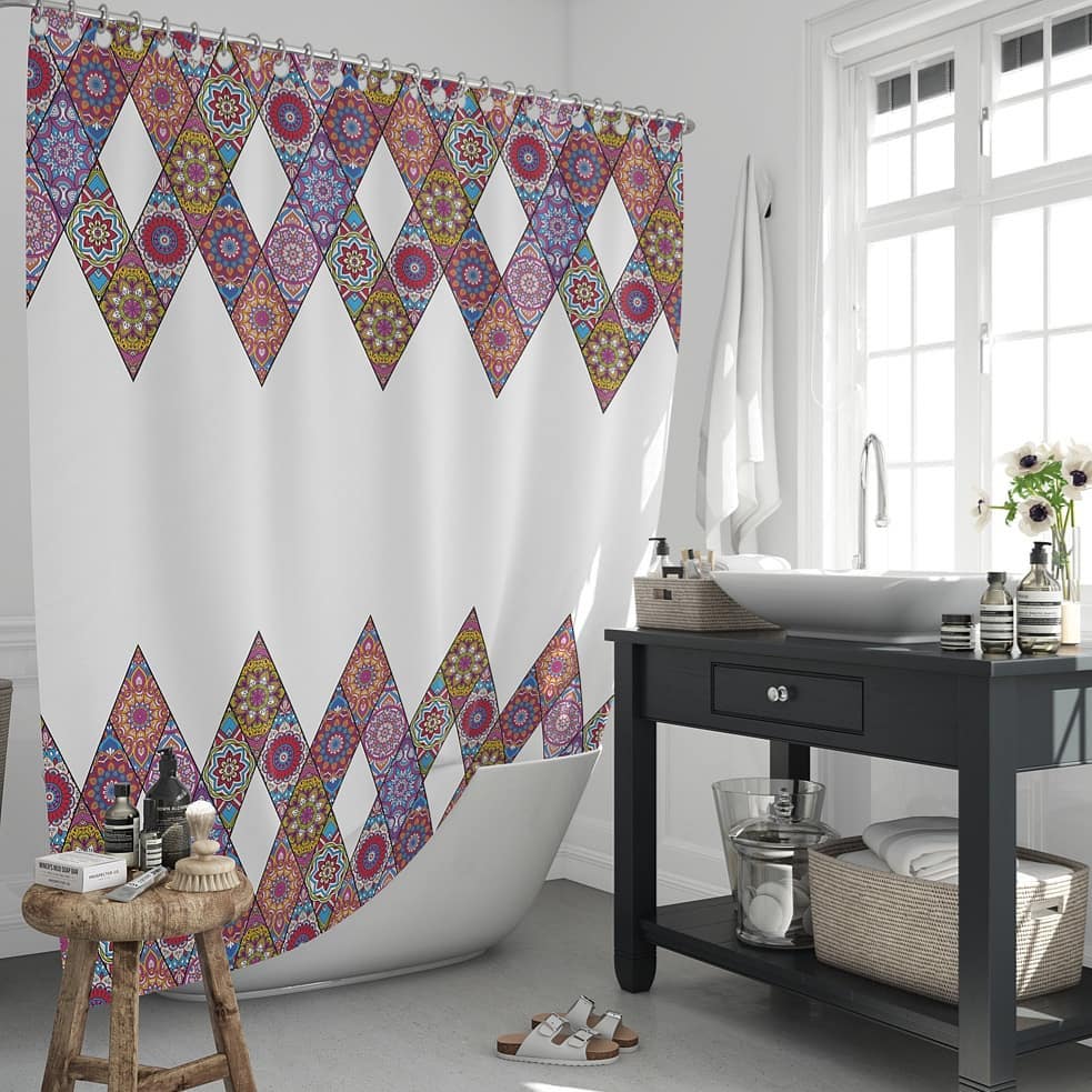 9. Vibrant Mosaic Tiles and Soft White Ruffles In a Compact Bathroom Setting