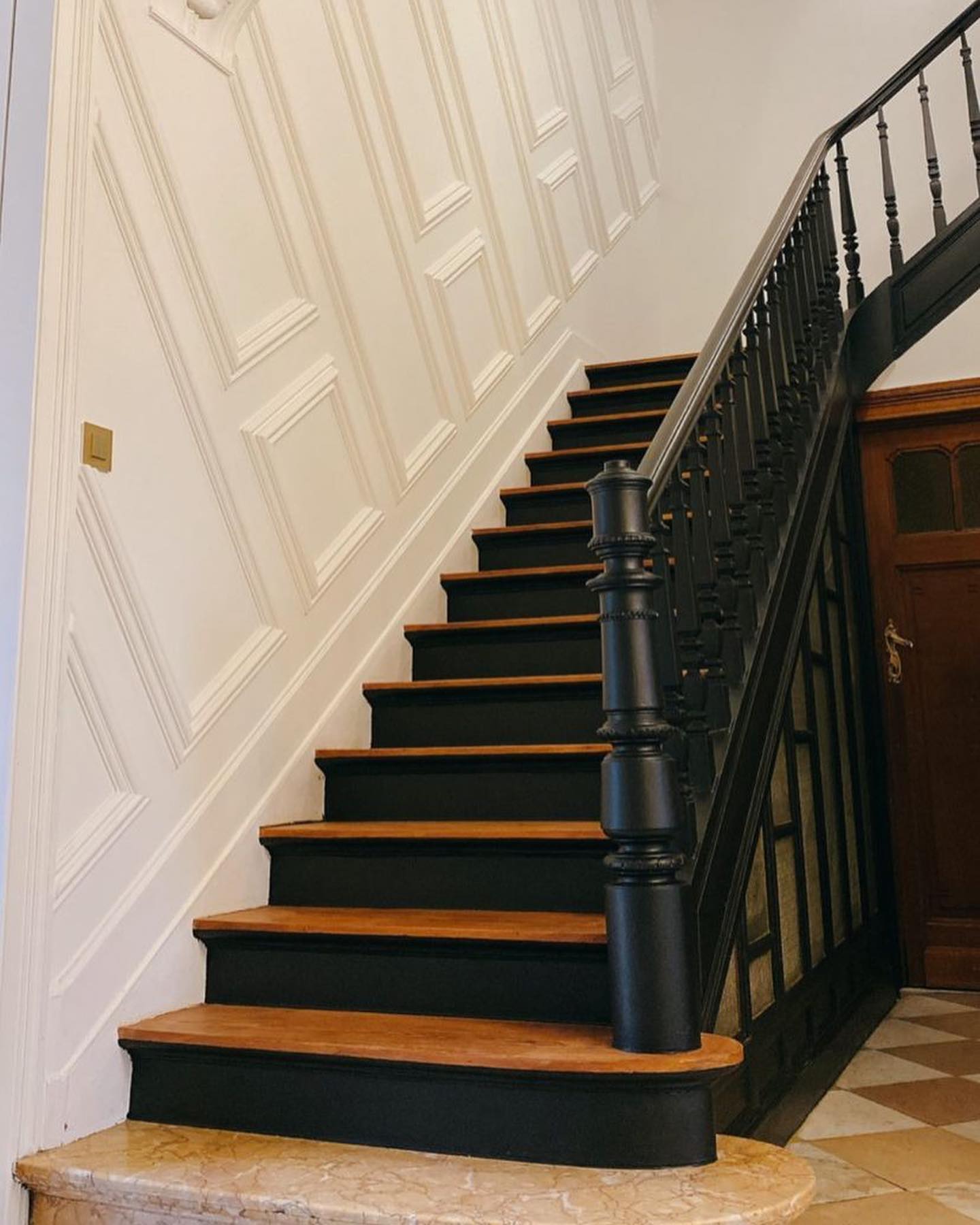 2. the Asymmetrical Zigzag Of Oak and Charcoal Tiles Ascending the Wall