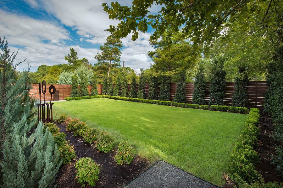 5. Crushed Stone Pathway with Embedded Solar Lights and White Picket Fence