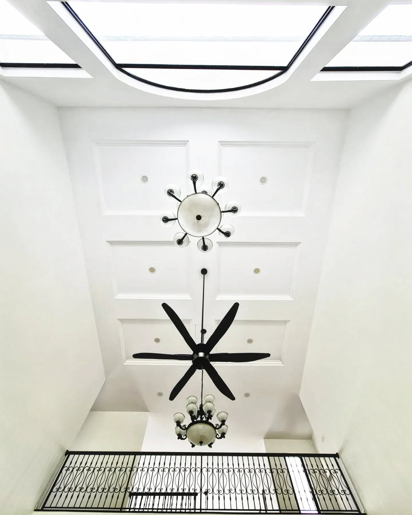 8. Majestic Arched Windows Frame a Sunlit Haven with a Grand Piano