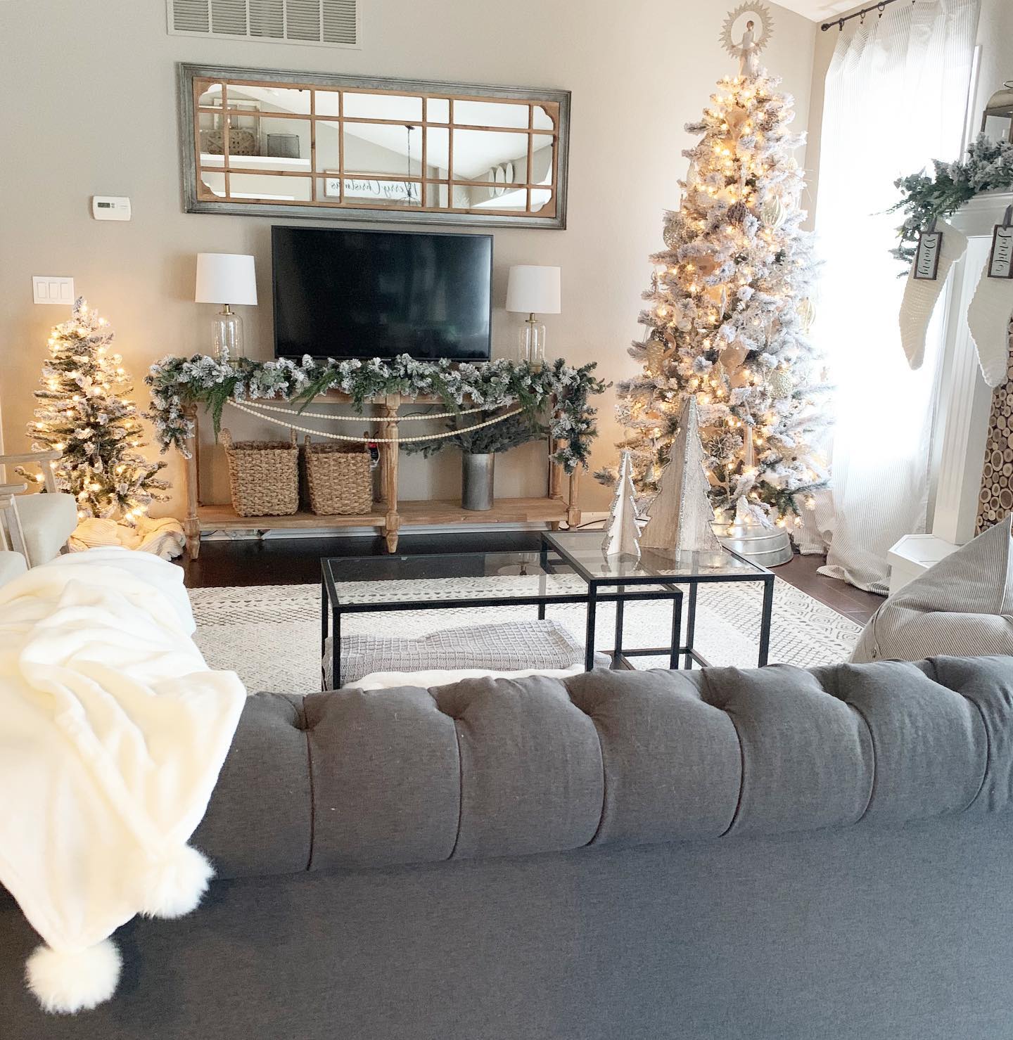 17. a Trio Of Geometric Globes on a Floating Shelf Above a Flatscreen Tv