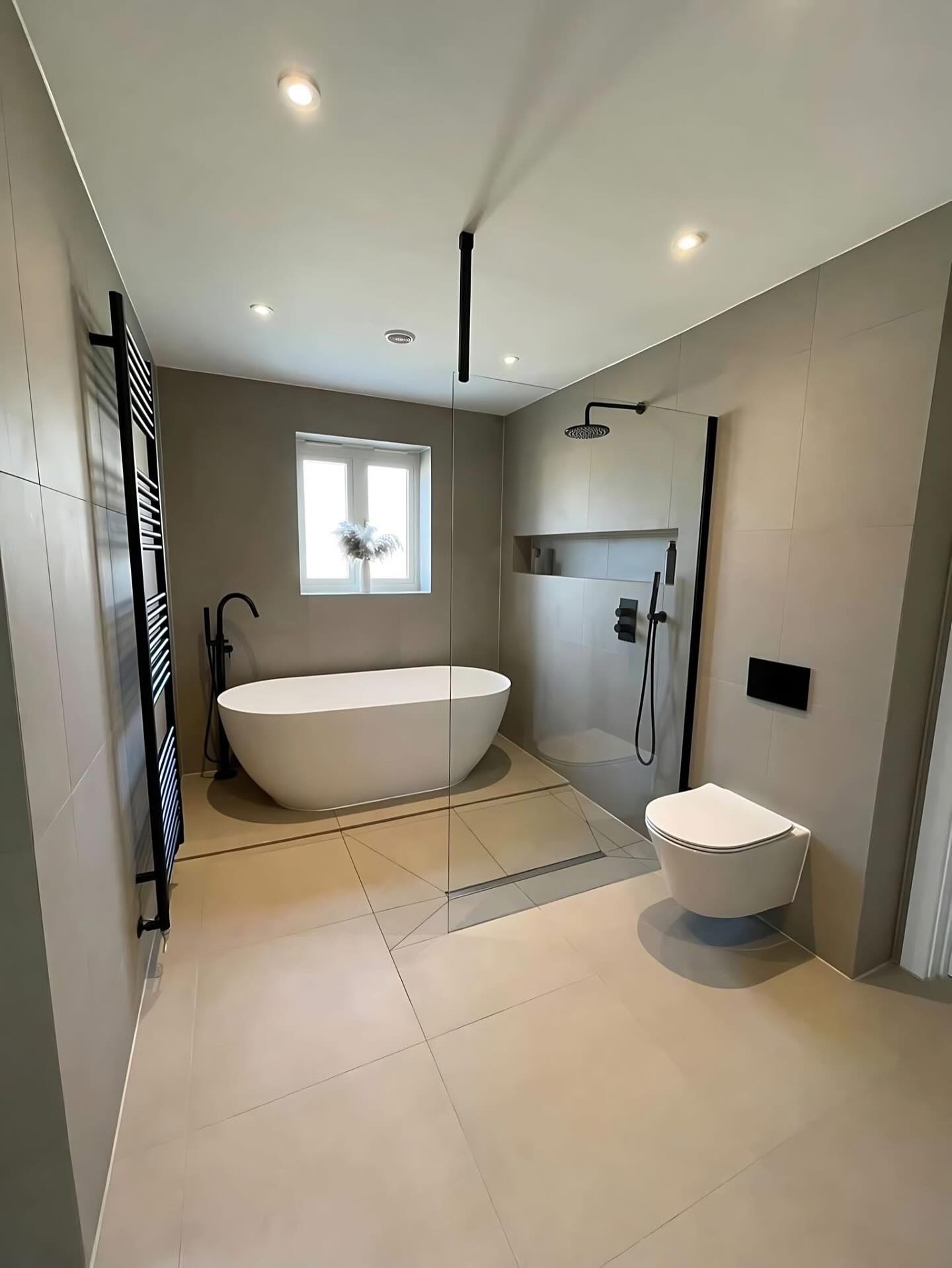 11. Cobalt Blue Tiles and River Rock Floor Walk-in Shower